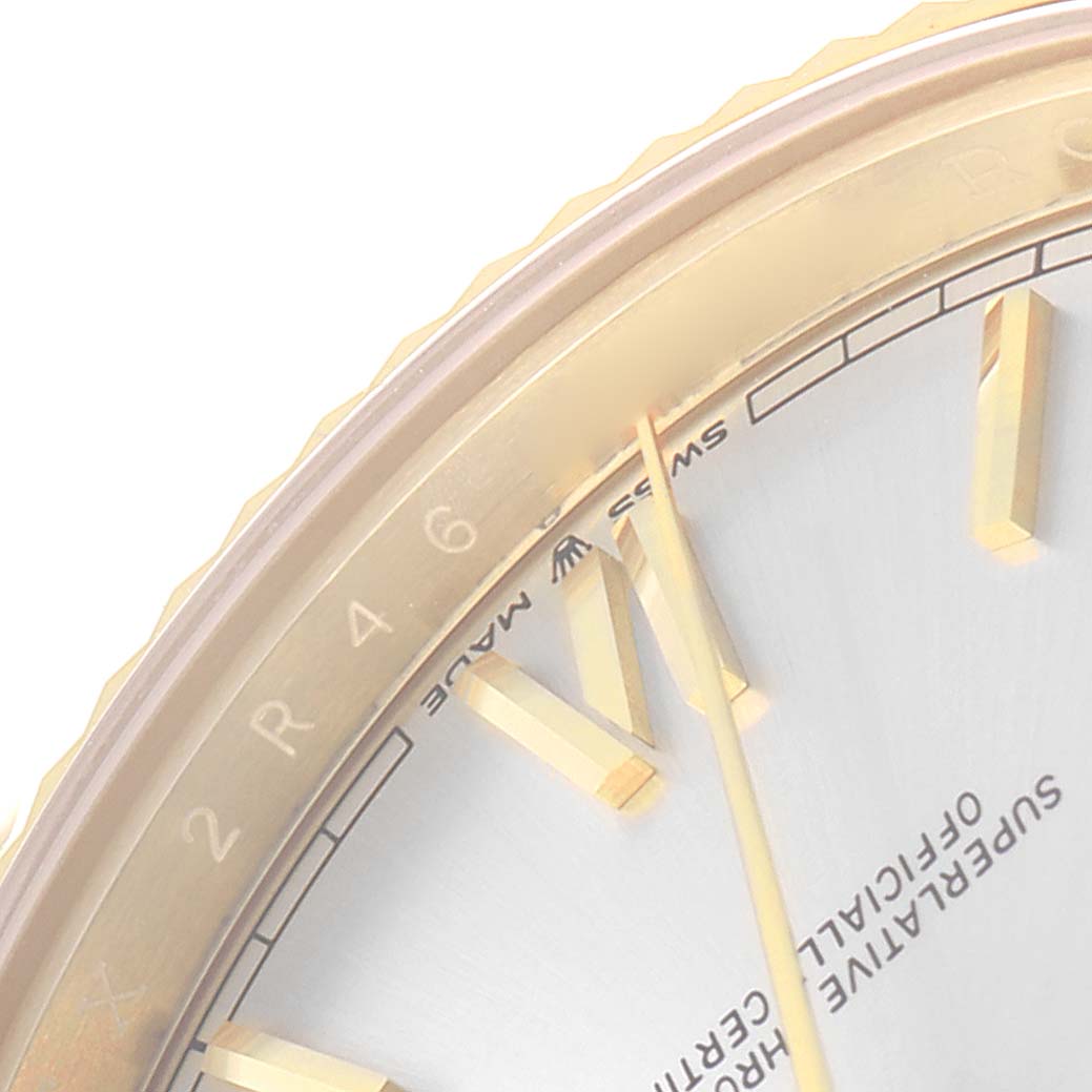 The image shows a close-up of the Rolex President model 228238 watch, highlighting part of the dial, hour markers, and the edge of the bezel.
