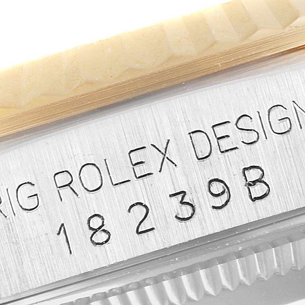 The image shows a close-up of the serial number and the fluted bezel of a Rolex President 18239 Men's White Gold Brown Dial 18239 Men's White Gold Brown Dial watch.