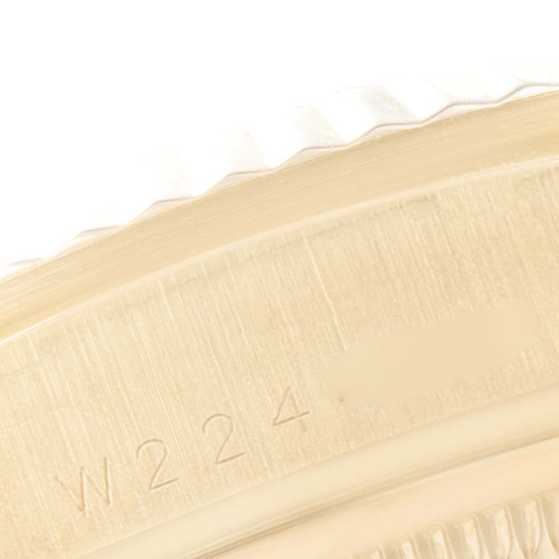 This image shows a close-up view of the outer edge and part of the case of a Rolex President 18238 Men's Yellow Gold Champagne Dial 18238 Men's Yellow Gold Champagne Dial model.