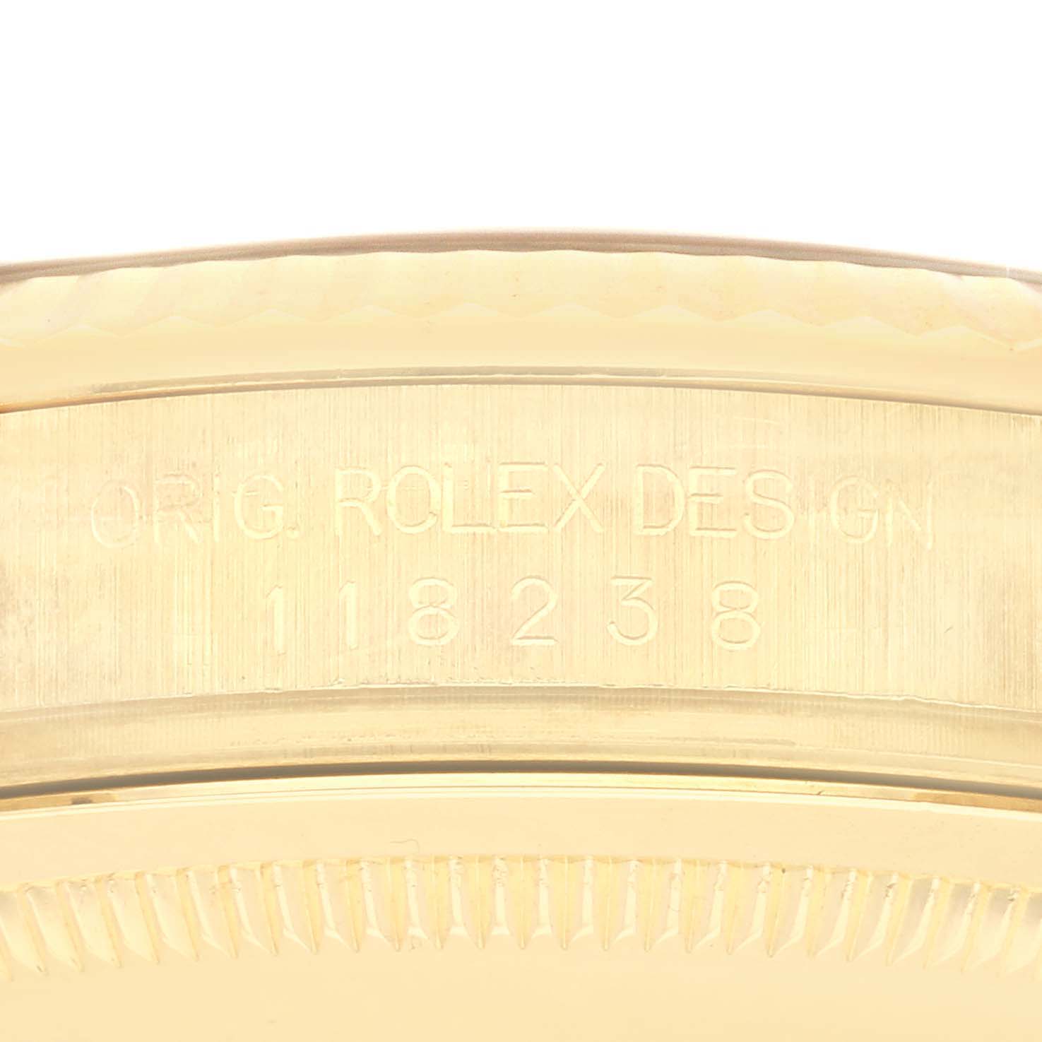 The image shows a close-up of the side of a Rolex President model 118238, displaying the engraved text "ORIG. ROLEX DESIGN" and the model number.