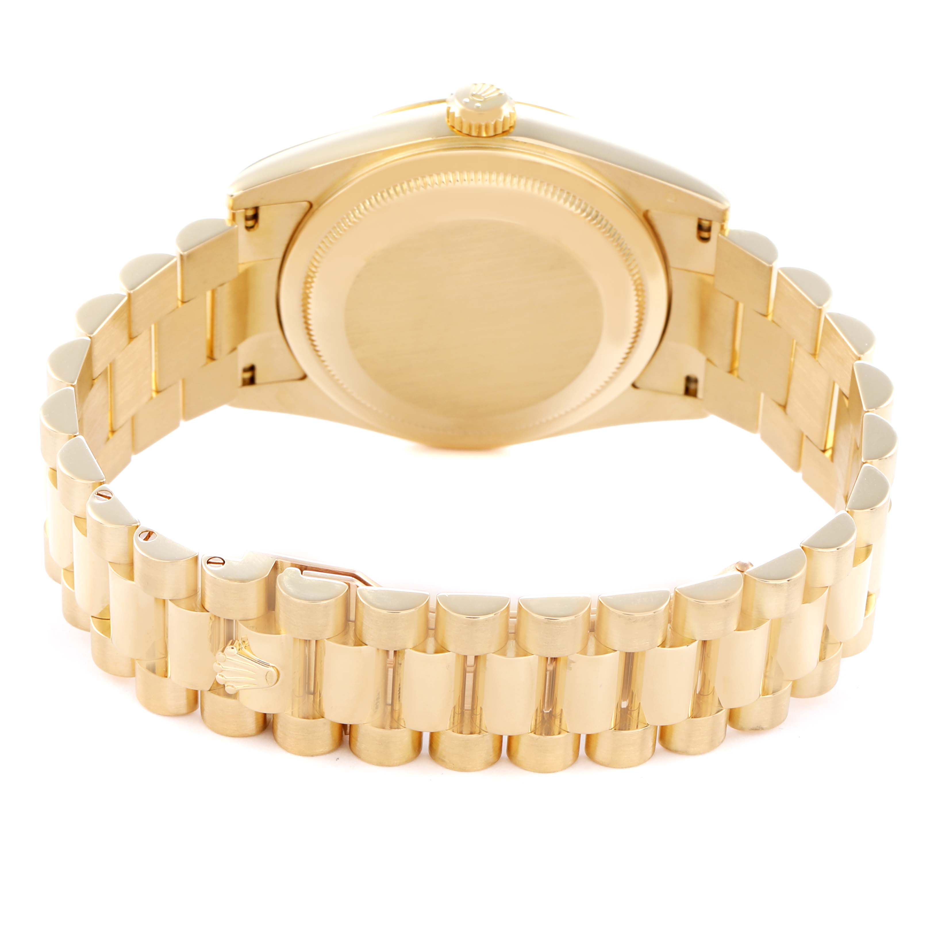 The image shows the Rolex Date model 118238 men
s watch from the back, highlighting the case back and the gold bracelet with its clasp.