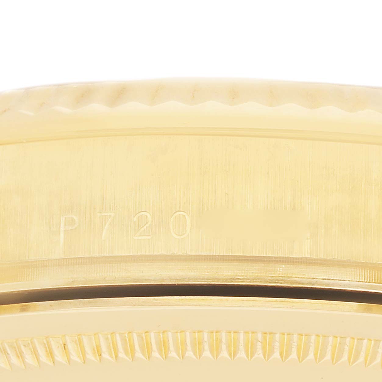 The image shows a close-up of the case side and bezel of the Rolex Date, model 118238, focusing on the edge and engraved details.