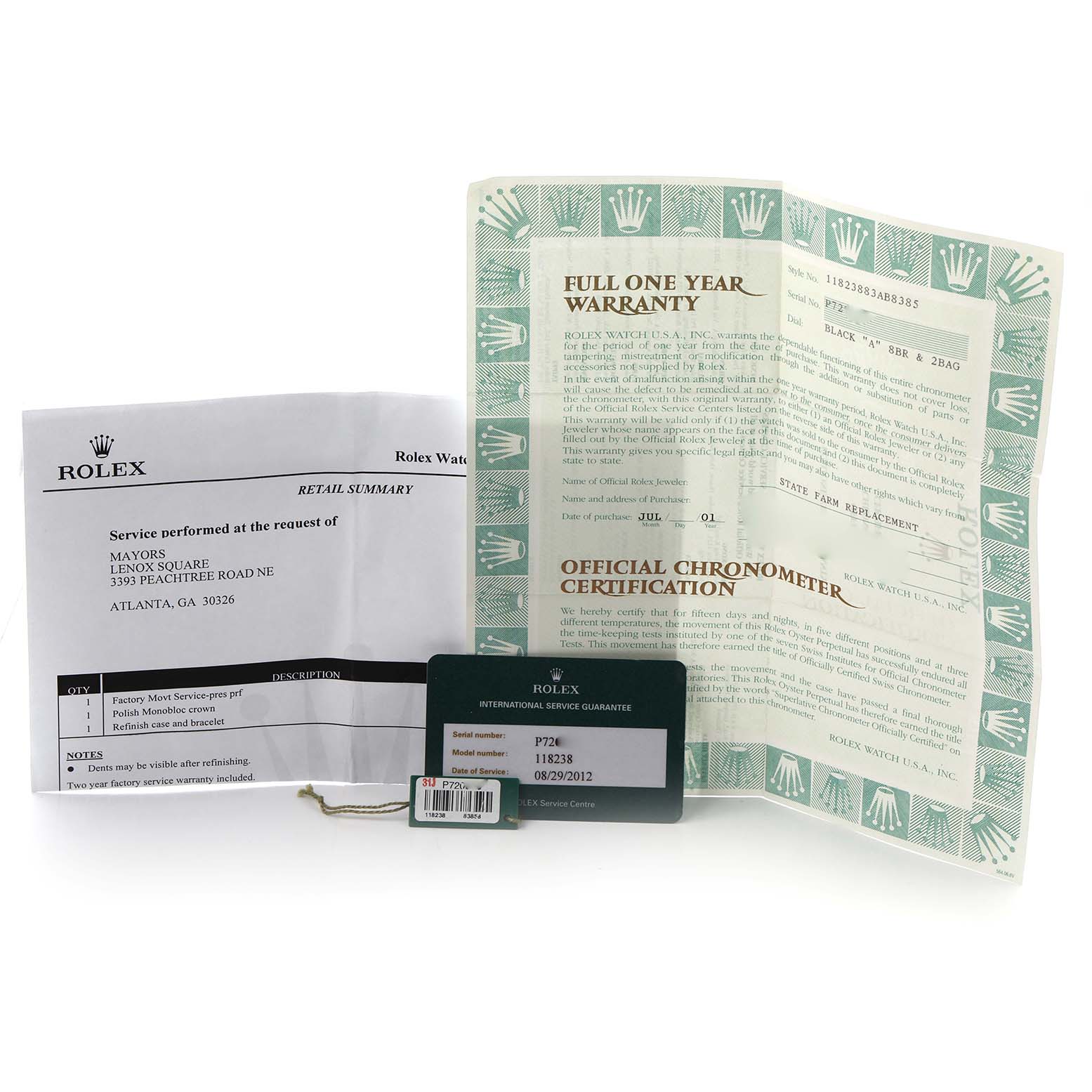 The image shows accessories for the Rolex Date model 118238, including warranty paperwork and a service guarantee card, arranged from a top-down angle.