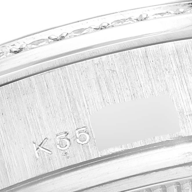 This close-up image shows the inner ring and part of the inscription of a Rolex President 179136 Women's Platinum Silver Dial 179136 Women's Platinum Silver Dial model watch.