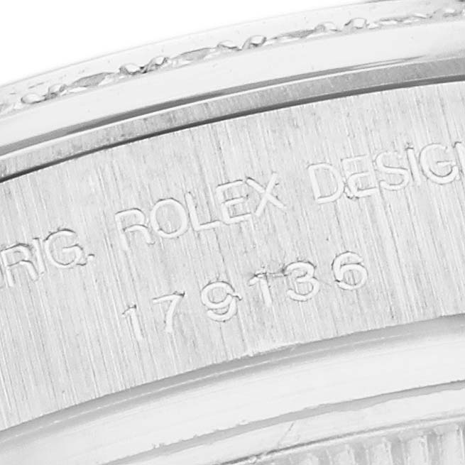 This close-up image shows the engraved model number on the side of a Rolex President 179136 Women's Platinum Silver Dial 179136 Women's Platinum Silver Dial watch case.
