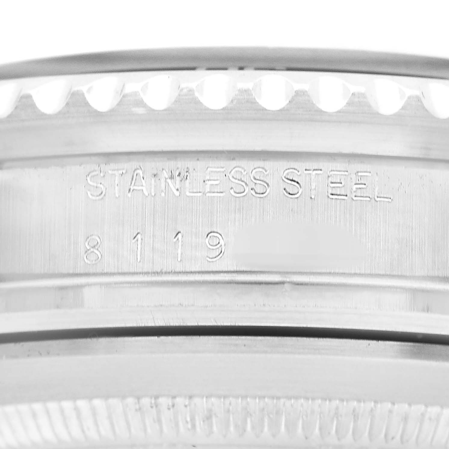 The image shows a close-up side angle of the bezel and edge of a Rolex Sea-Dweller 16660 Men's Stainless Steel Black Dial, highlighting the "Stainless Steel" engraving and part of the serial number.