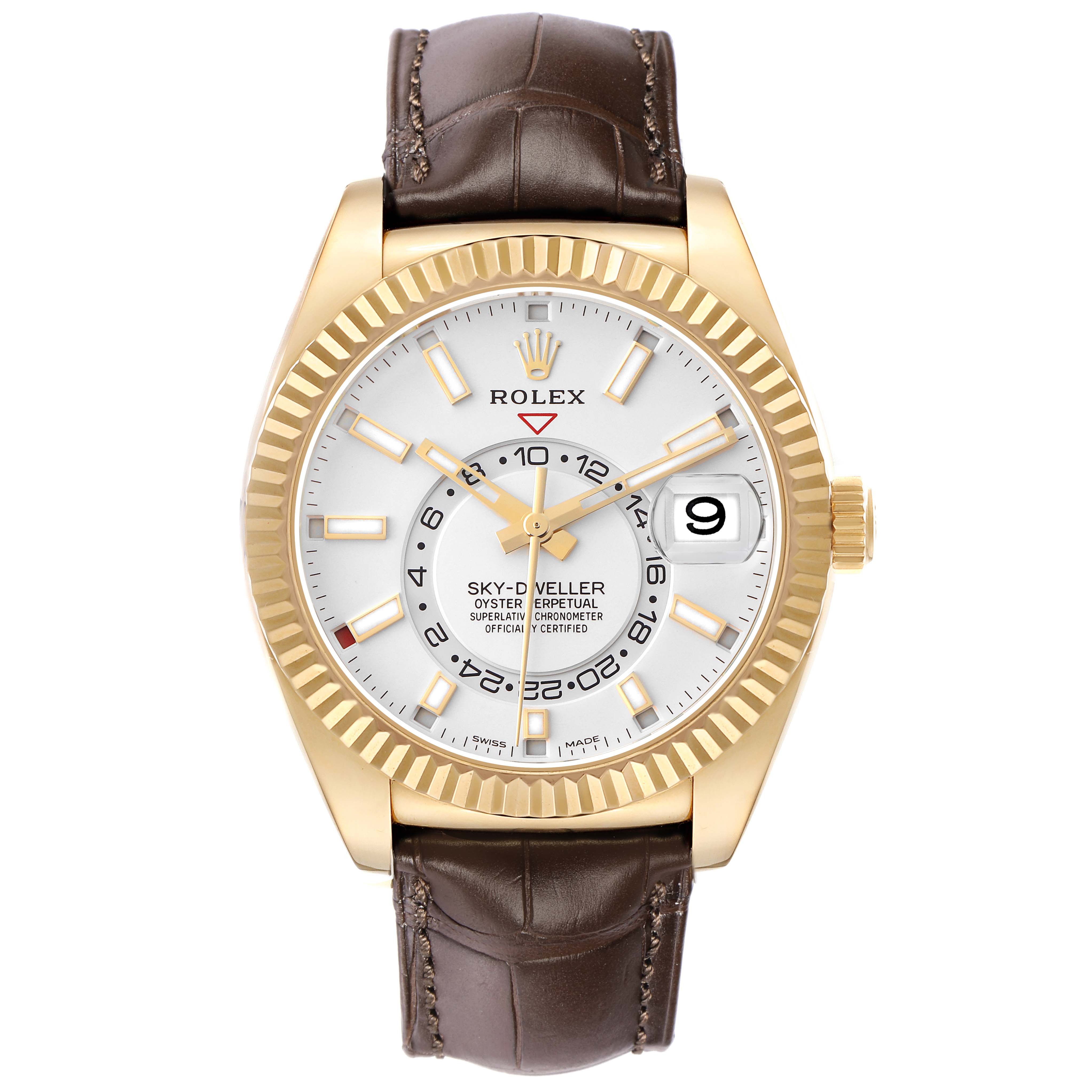 The image shows a Rolex Sky-Dweller model 326138, viewed from the front, showcasing its gold case, white dial, fluted bezel, and brown leather strap.