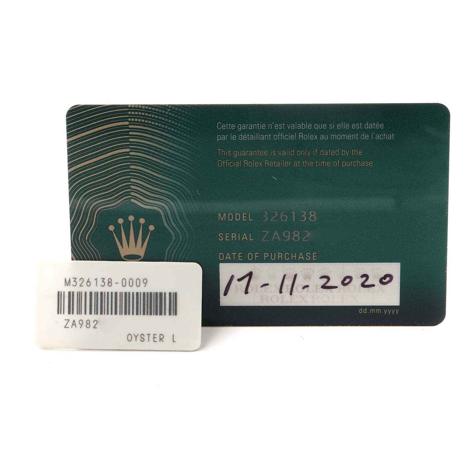 The image shows a guarantee card and tag for the Rolex Sky-Dweller model 326138, highlighting the model number, serial number, and purchase date.