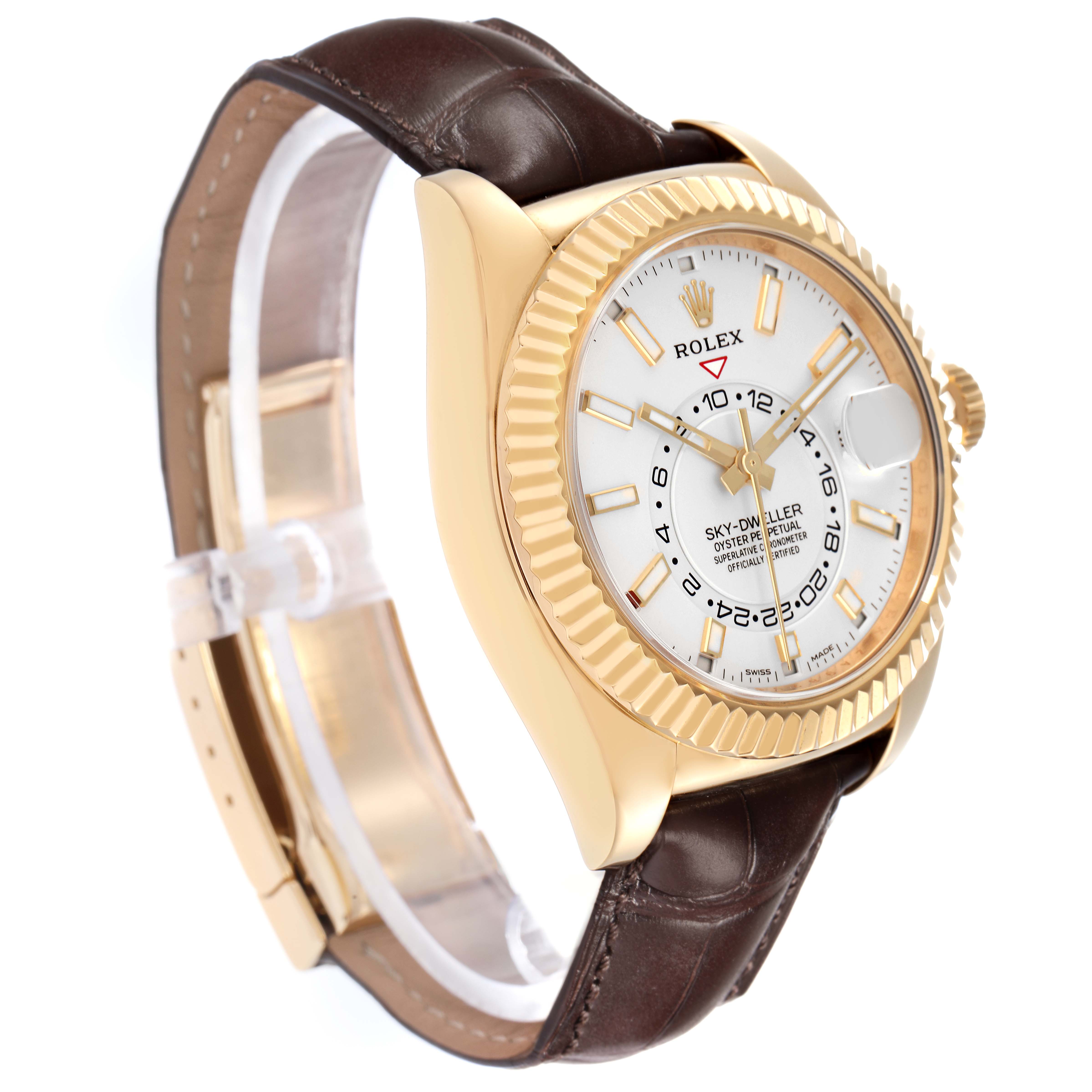 The Rolex Sky-Dweller model 326138 is shown at a slight angle, highlighting the gold case, fluted bezel, white dial, and brown leather strap.