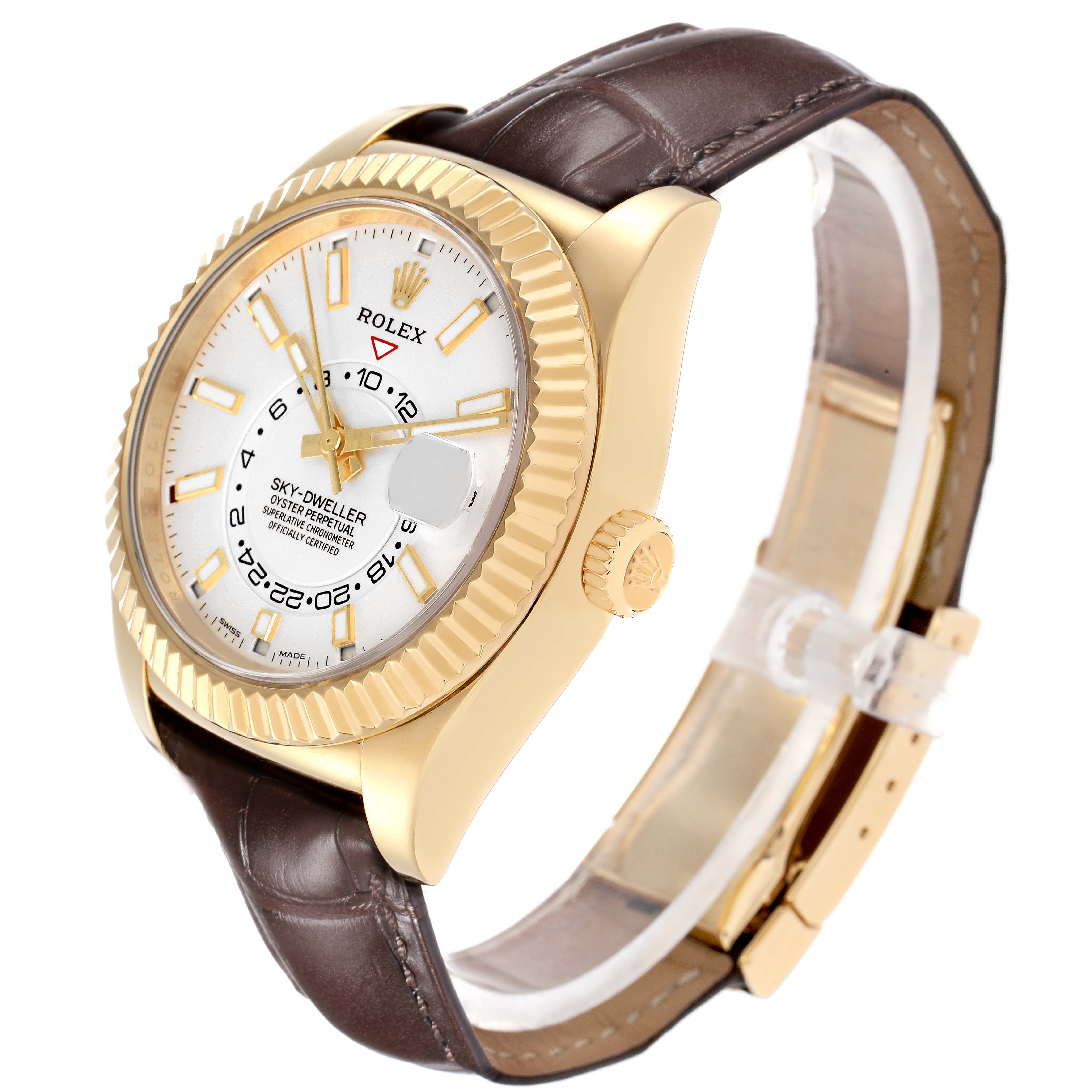 The Rolex Sky-Dweller model 326138 watch is shown at a diagonal angle, highlighting the gold case, white dial, bezel, crown, and brown leather strap.