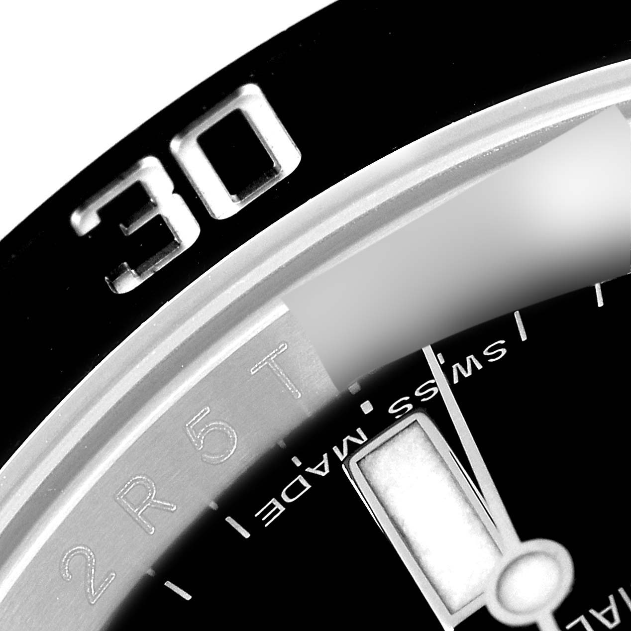 This close-up image shows a portion of the bezel and dial of a Rolex Submariner 116610 Men
s Stainless Steel Black Dial 116610 Men
s Stainless Steel Black Dial watch, focusing on the "30" mark and part of the "Swiss Made" text.