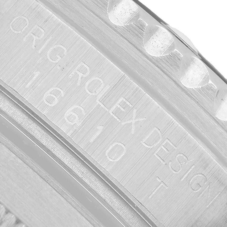 The image shows a close-up of the engraving on the Rolex Submariner 16610 Men's Stainless Steel Black Dial's inner case, displaying the model number 16610.