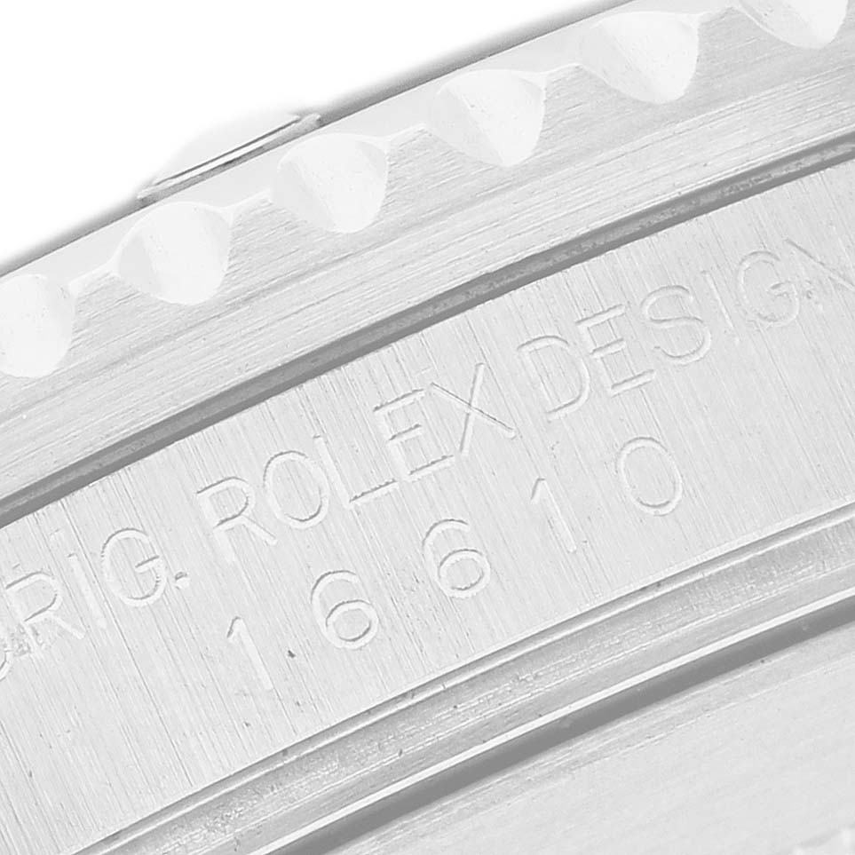 The image shows a close-up of the engraved side of a Rolex Submariner 16610 Men's Stainless Steel Black Dial watch case, featuring its model number.