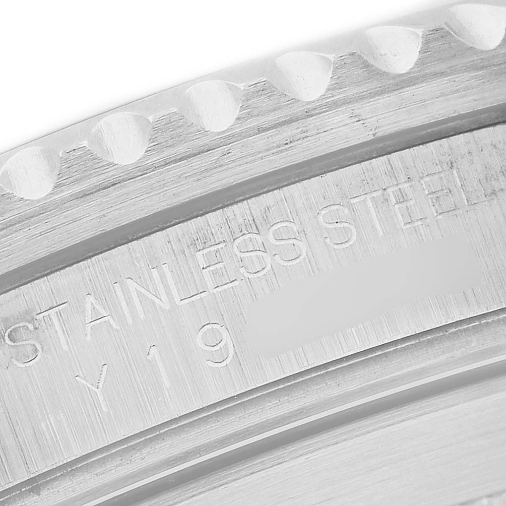 The image shows a close-up of the engraved stainless steel case back of a Rolex Submariner 16610 Men's Stainless Steel Black Dial.