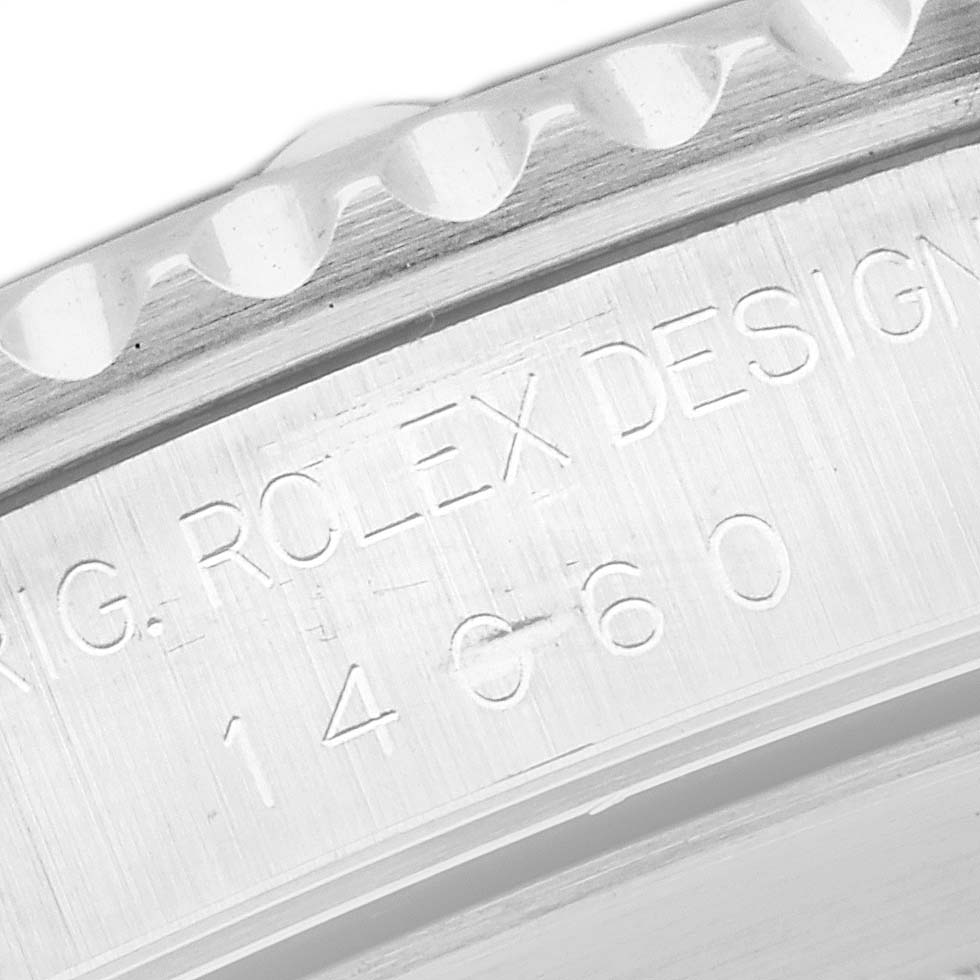 The image shows an engraved side view of the bezel and case of a Rolex Submariner 14060 Men
s Stainless Steel Black Dial 14060 Men
s Stainless Steel Black Dial watch.