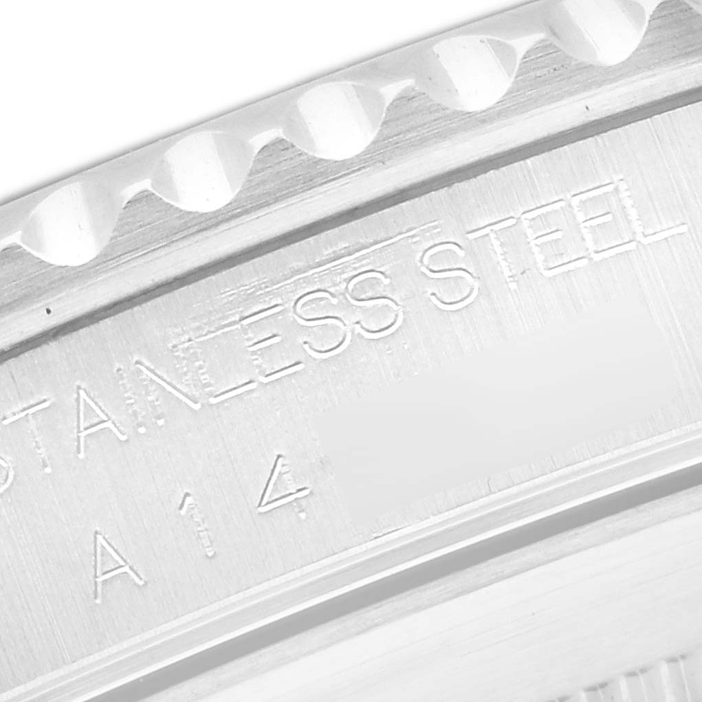 Close-up view of the edge and case back with engravings on a Rolex Submariner 14060 Men
s Stainless Steel Black Dial 14060 Men
s Stainless Steel Black Dial watch.