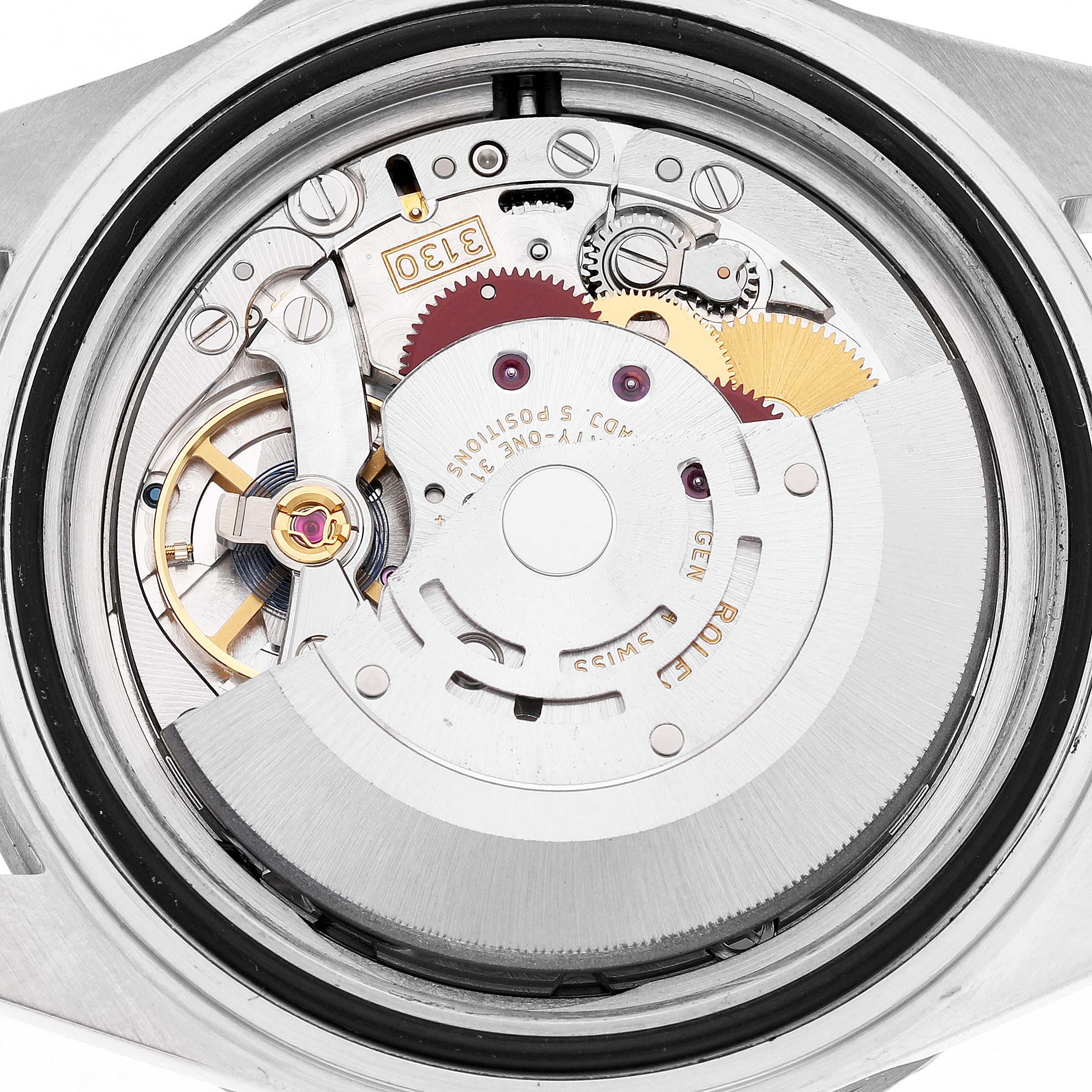 The image shows the movement of a Rolex Submariner 14060 Men's Stainless Steel Black Dial watch from a top-down angle, highlighting its intricate internal mechanisms.