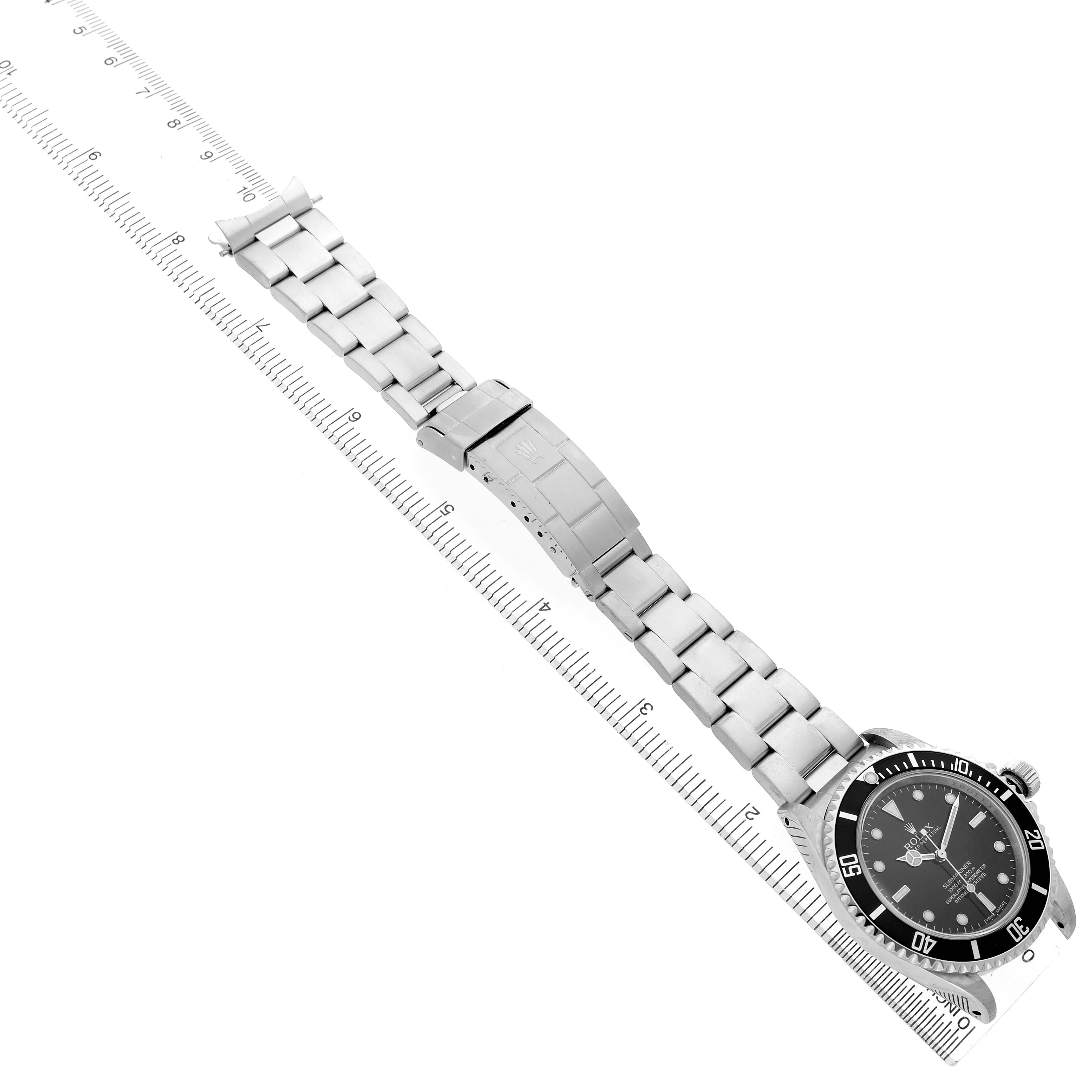 The image shows a Rolex Submariner 14060 Men's Stainless Steel Black Dial watch from a top-down angle, highlighting the watch face, bezel, bracelet, and clasp.