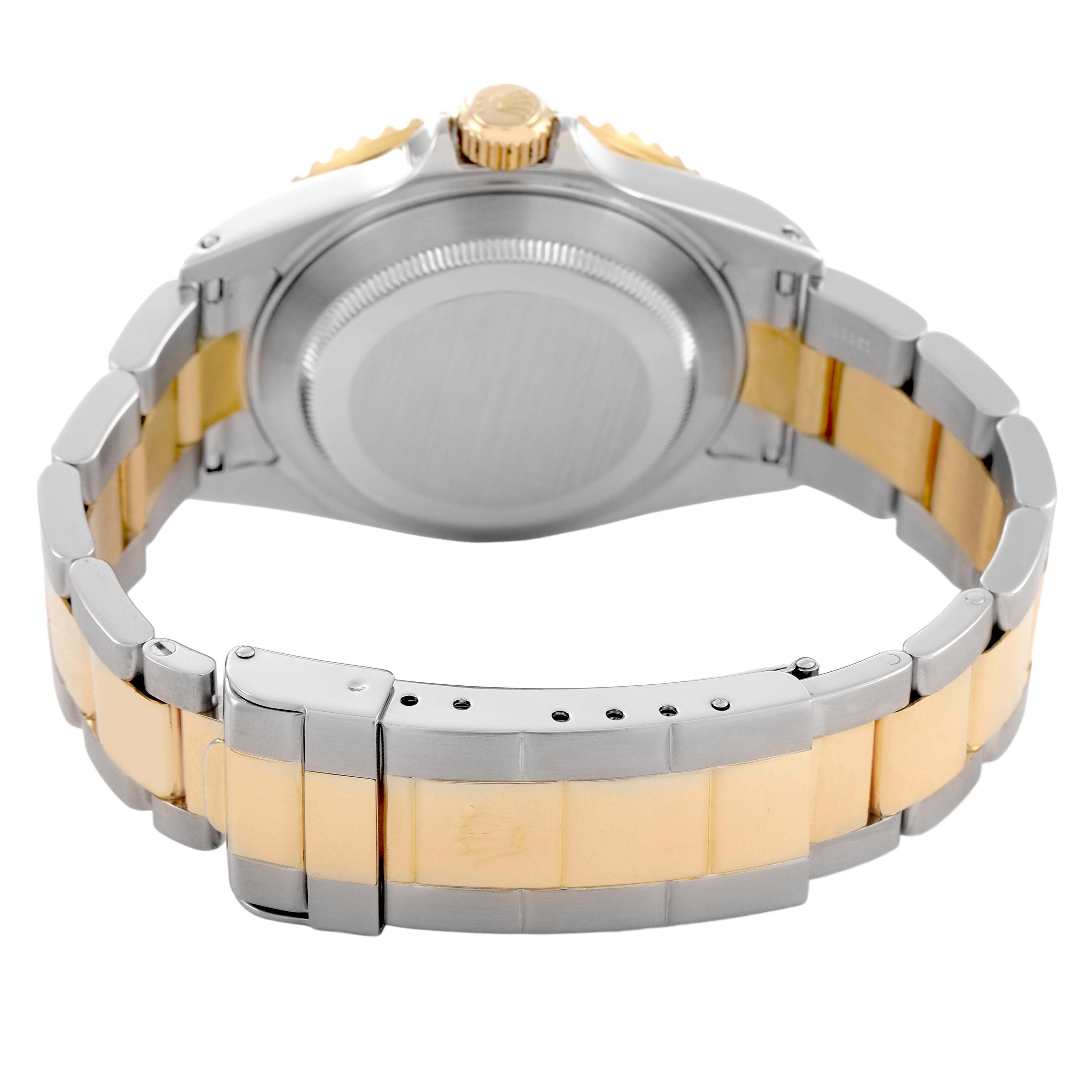 The image shows the back of a Rolex Submariner 16613 Men's Steel and Gold (two tone) Blue Dial watch, highlighting the case, bracelet, and clasp from a rear angle.