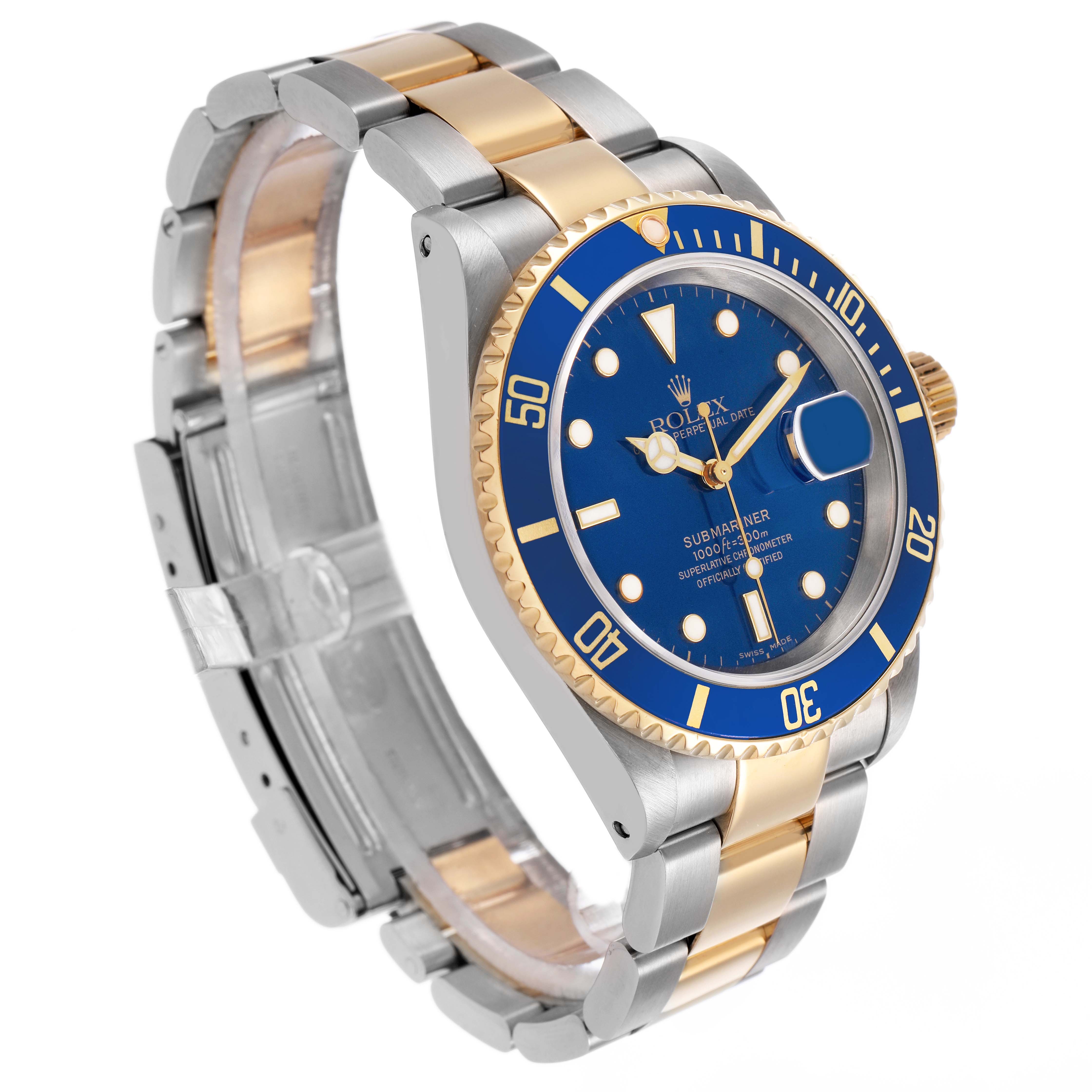 The Rolex Submariner 16613 Men's Steel and Gold (two tone) Blue Dial watch is shown at a slight angle, displaying its bezel, dial, bracelet, and clasp.