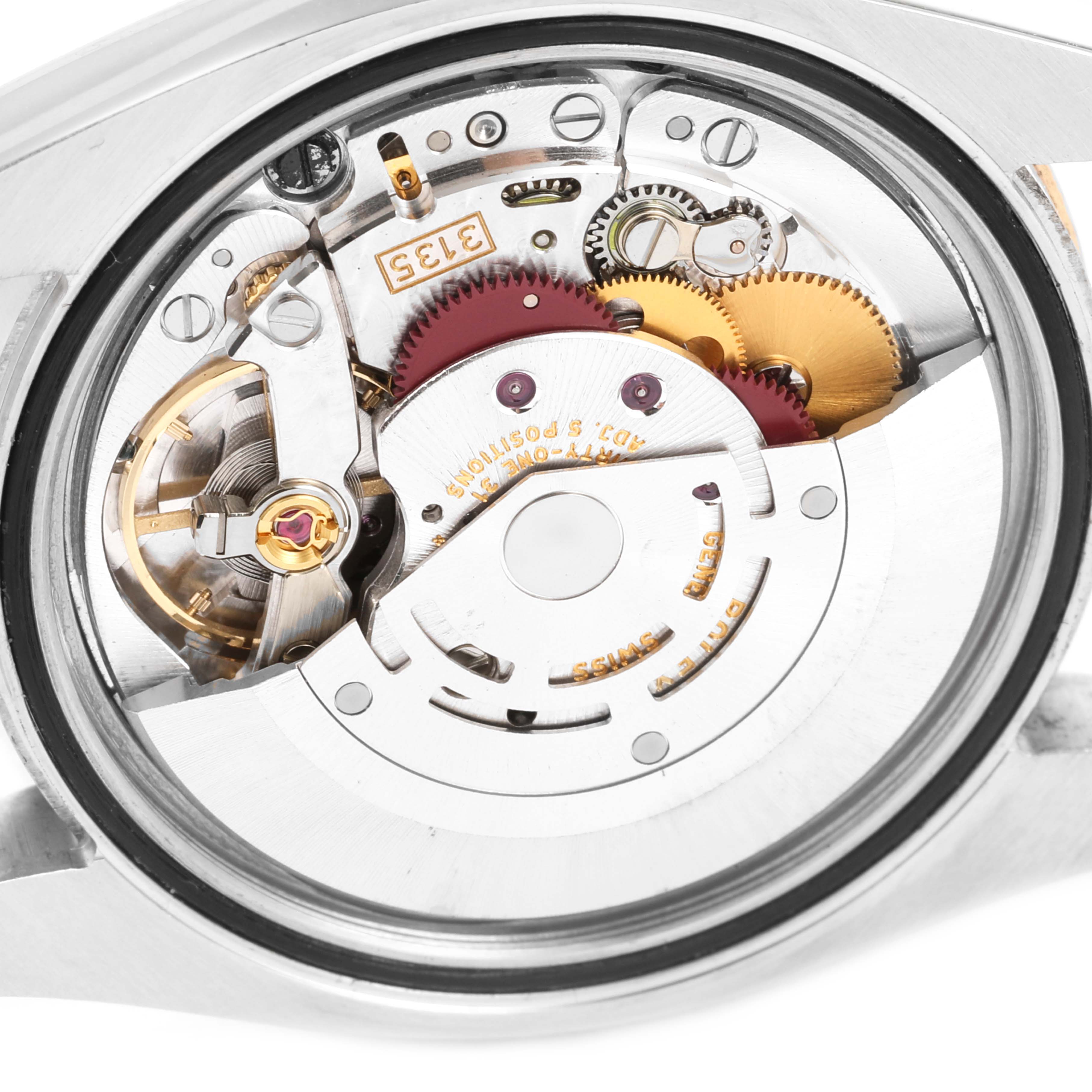 The image shows the inner mechanism of a Rolex Turn-o-Graph 116261 Men
s Steel and Gold (two tone) Black Dial 116261 Men
s Steel and Gold (two tone) Black Dial watch at a close-up angle, highlighting gears and components.