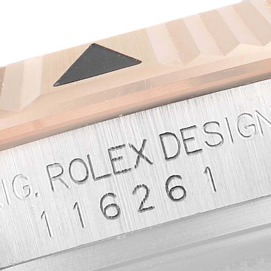 This close-up image shows the bezel and serial number engraving on a Rolex Turn-o-Graph 116261 Men
s Steel and Gold (two tone) Black Dial 116261 Men
s Steel and Gold (two tone) Black Dial watch.