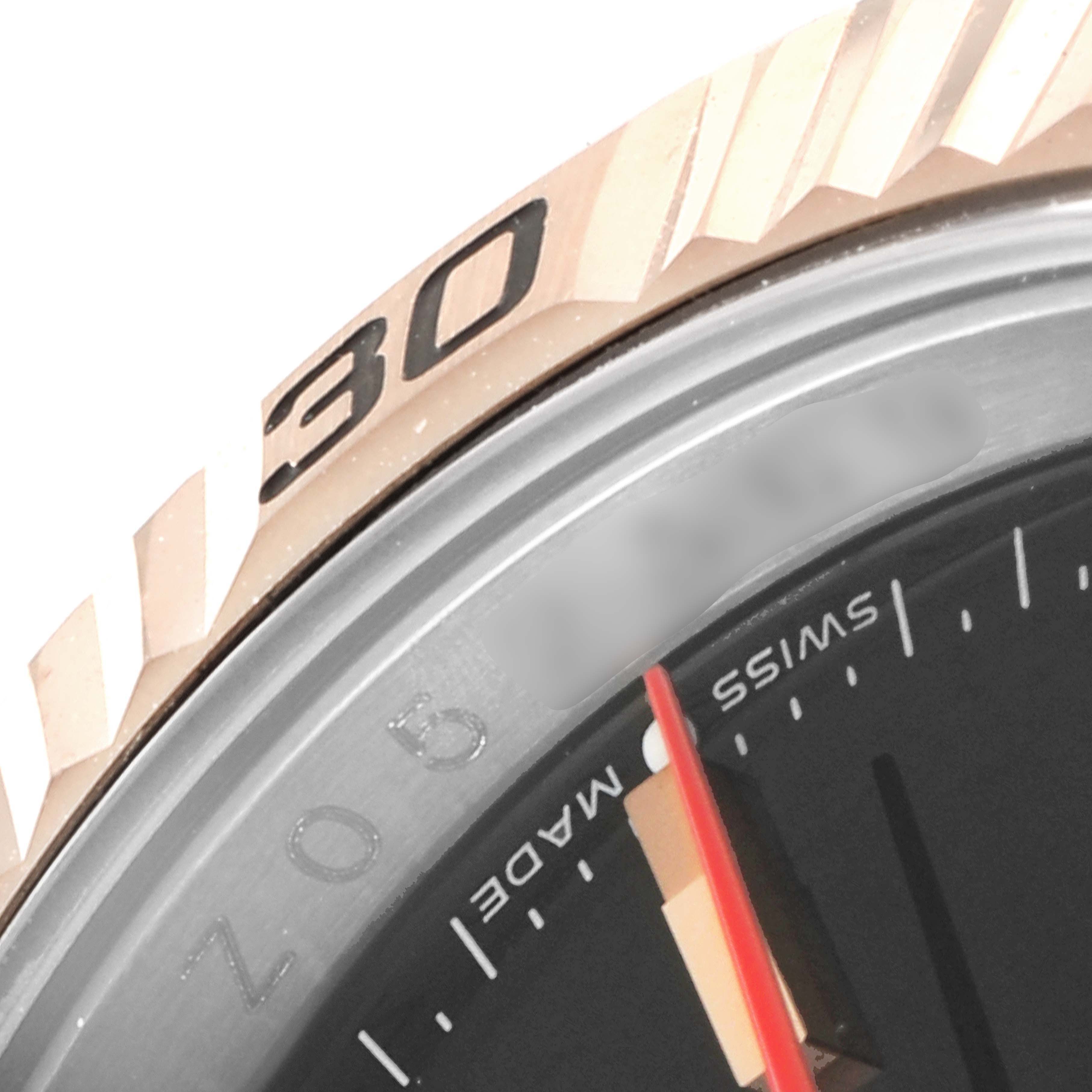 The image shows a close-up of the bezel, part of the dial, and the red second hand of a Rolex Turn-o-Graph 116261 Men
s Steel and Gold (two tone) Black Dial 116261 Men
s Steel and Gold (two tone) Black Dial watch.