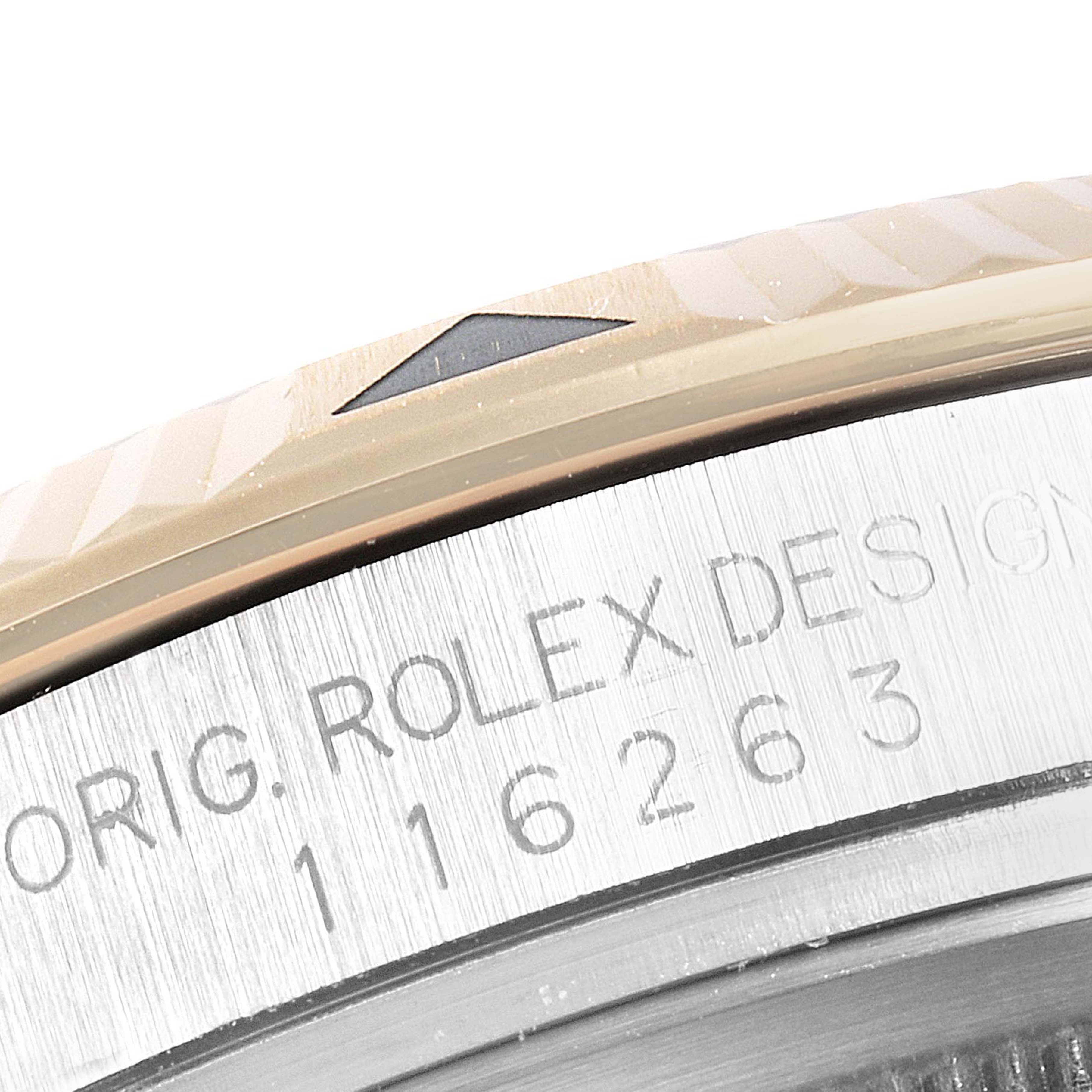 This image shows a close-up of the Rolex Turn-o-Graph 116263 Men
s Steel and Gold (two tone) Grey Dial 116263 Men
s Steel and Gold (two tone) Grey Dial model
s bezel and part of the engraved watch case.