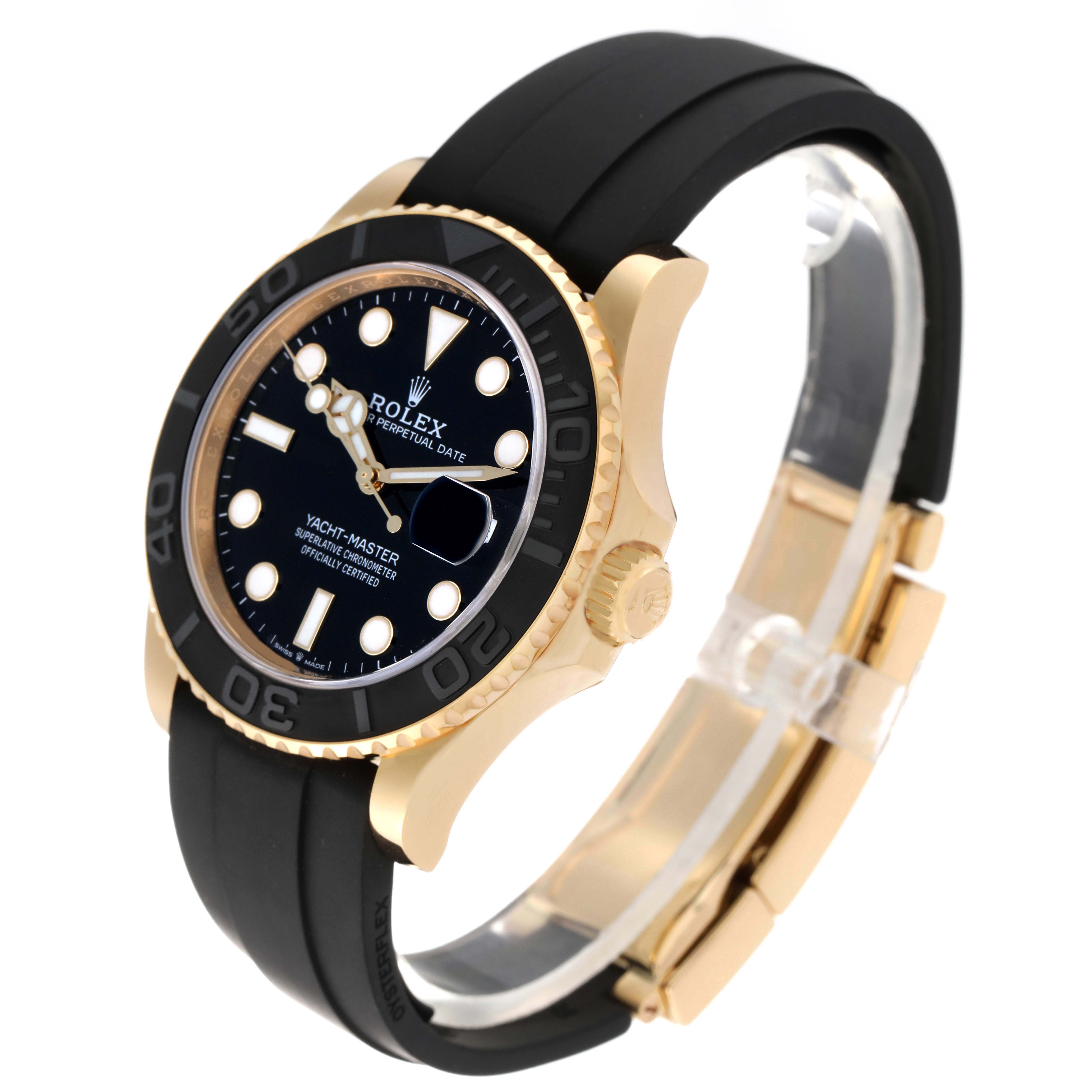 The Rolex Yacht-Master model 226658 is shown at an angled side view, highlighting the black dial, bezel, and rubber strap with gold accents.