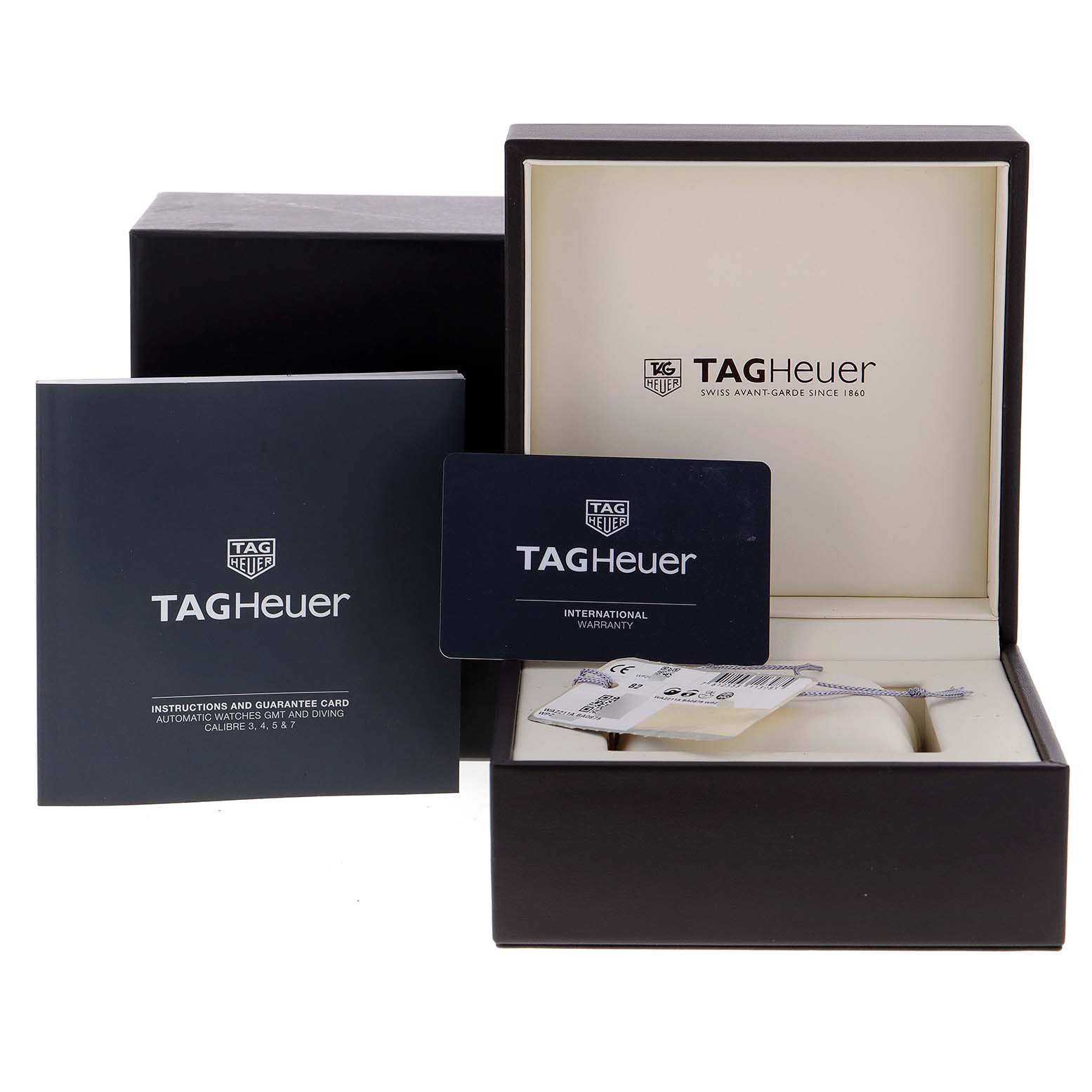 The image shows the packaging, warranty card, and instruction booklet for the Tag Heuer Formula 1 WAZ211A.BA0875 Men's Stainless Steel Black Dial WAZ211A.BA0875 Men's Stainless Steel Black Dial watch, with the watch itself partially visible.