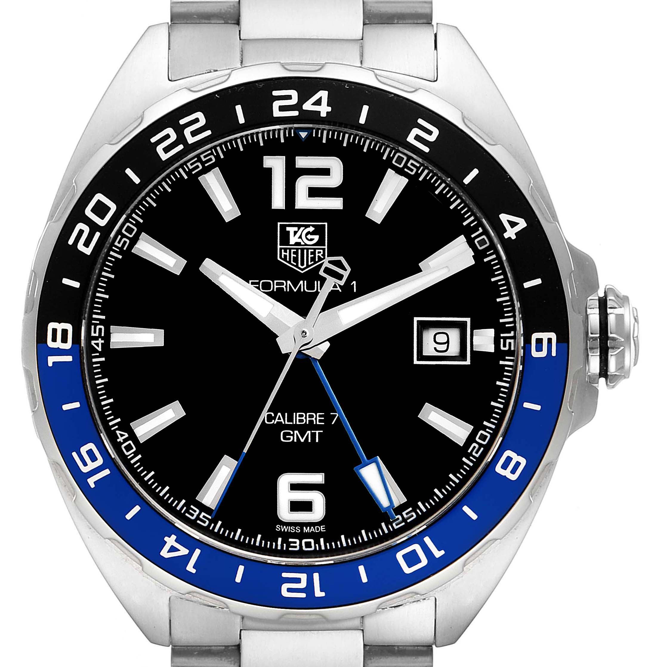 This image shows the face of the Tag Heuer Formula 1 WAZ211A.BA0875 Men's Stainless Steel Black Dial WAZ211A.BA0875 Men's Stainless Steel Black Dial Calibre 7 GMT watch, including the hour, minute, and second hands, date, and bezel.
