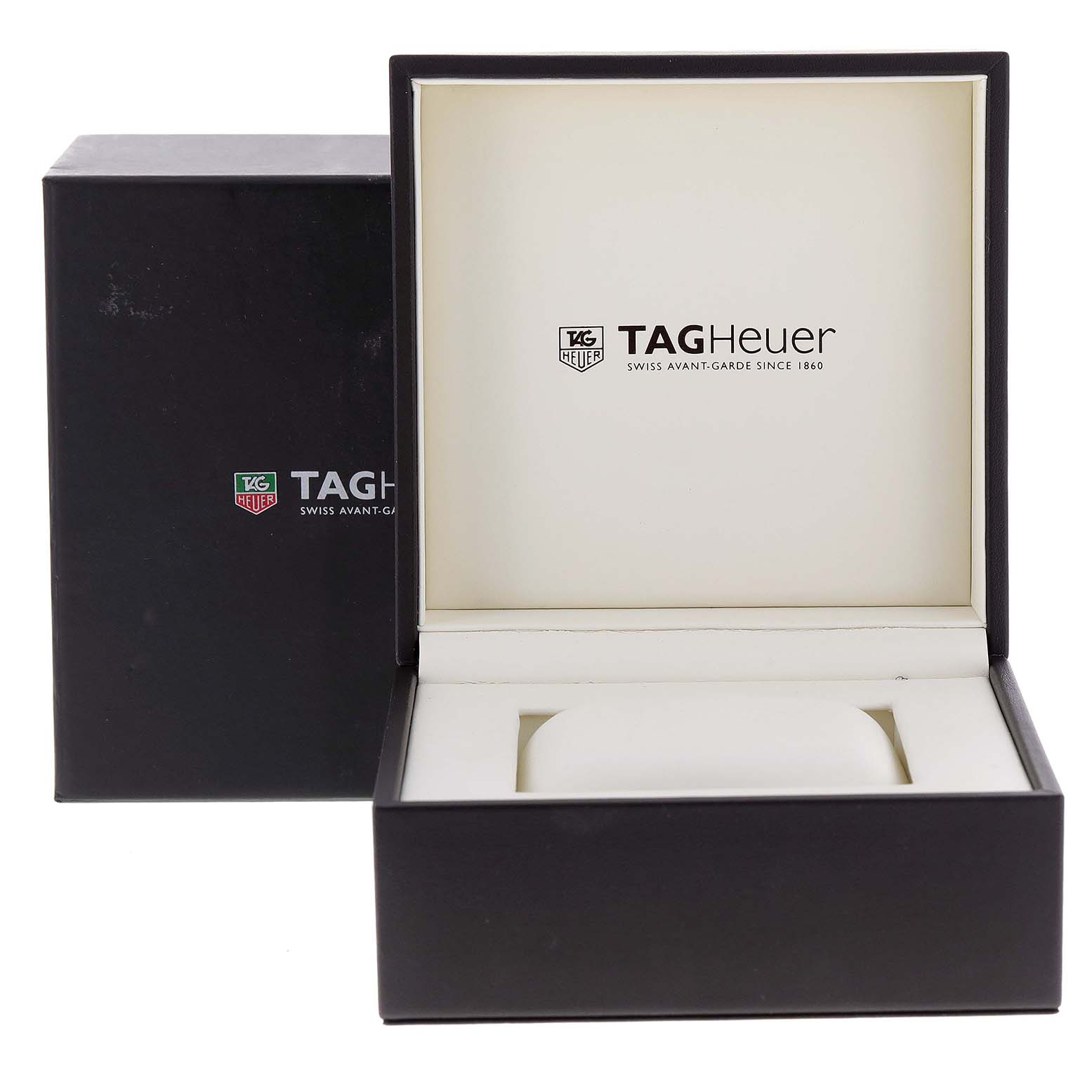 The image shows an open Tag Heuer watch box with the brand logo, model Monaco, and its cushion.