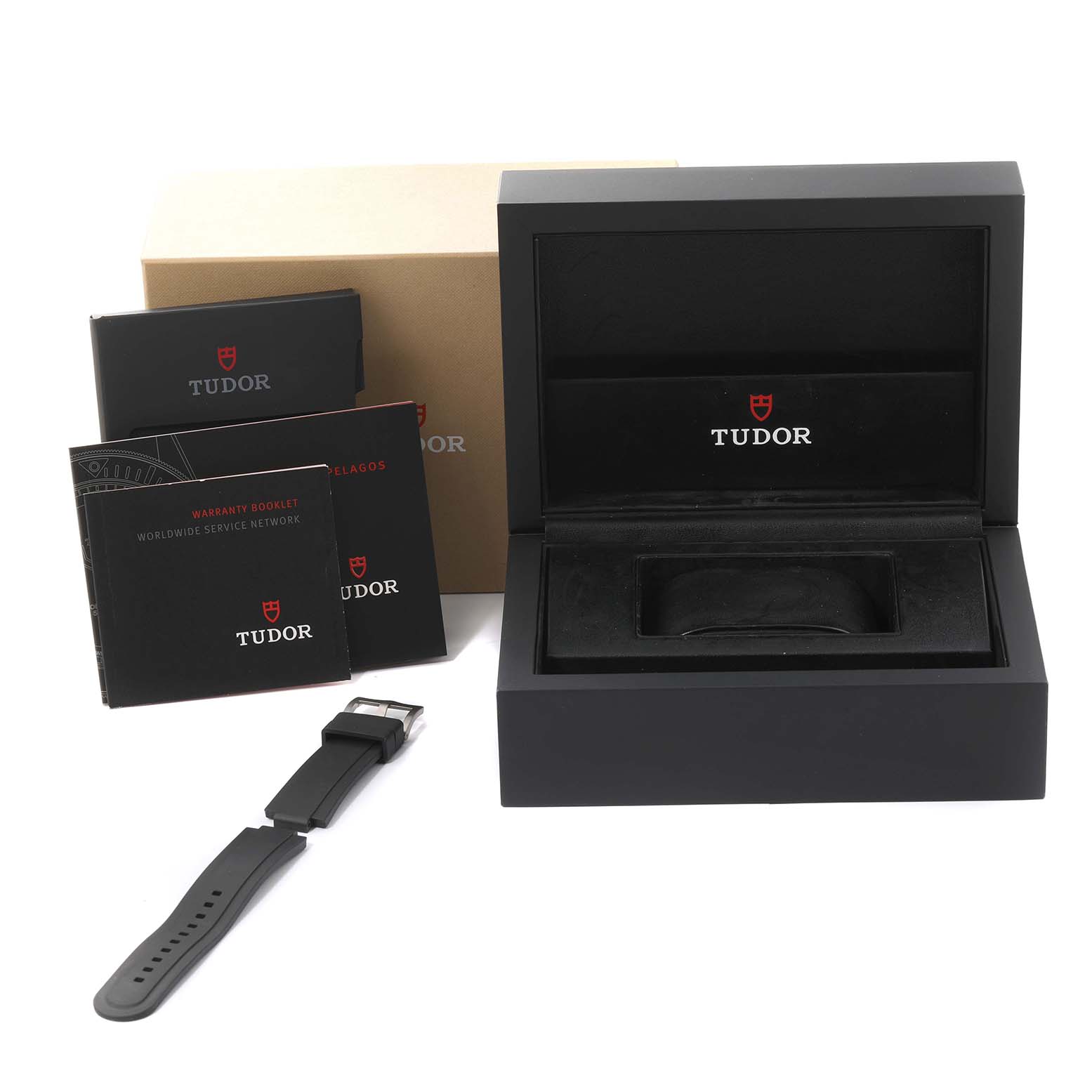 The image shows a Tudor Pelagos 25500TN Men's Titanium Black Dial 25500TN Men's Titanium Black Dial watch box, booklet, warranty card, and an extra rubber strap.