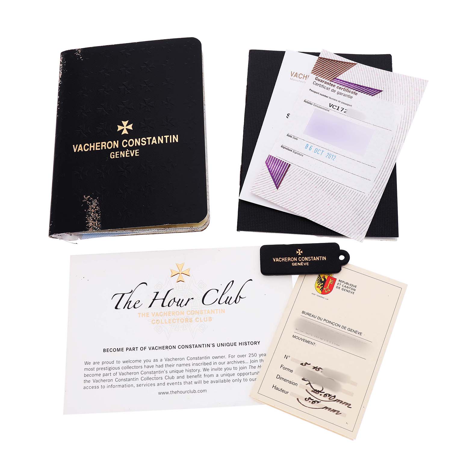 The image shows accessories for the Vacheron Constantin Quai de L'Ile, including booklets, a certificate, and a keychain.