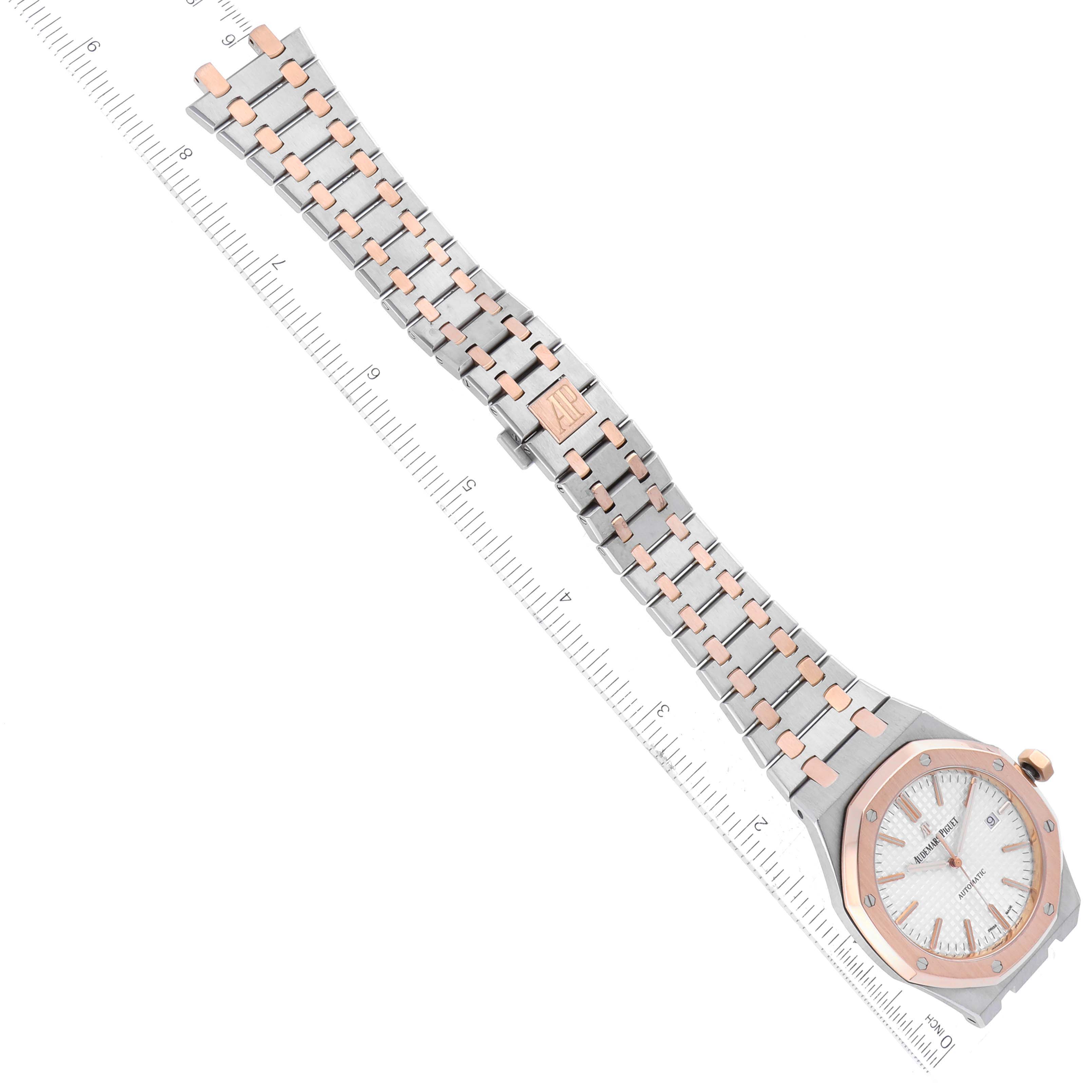 The image shows an overhead view of an Audemars Piguet Royal Oak 15400SR Men's Steel and Gold (two tone) Silver Dial 15400SR Men's Steel and Gold (two tone) Silver Dial watch, focusing on the watch face, case, and bracelet, next to a ruler for scale.