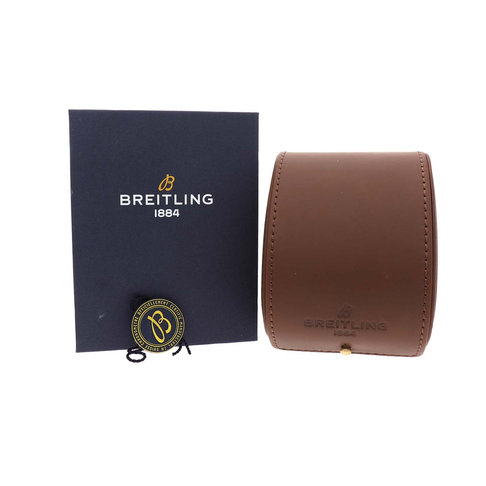 The image shows a Breitling Chronoliner R24312 Men's Rose Gold Black Dial's packaging with a brown case, a booklet, and a hang tag.