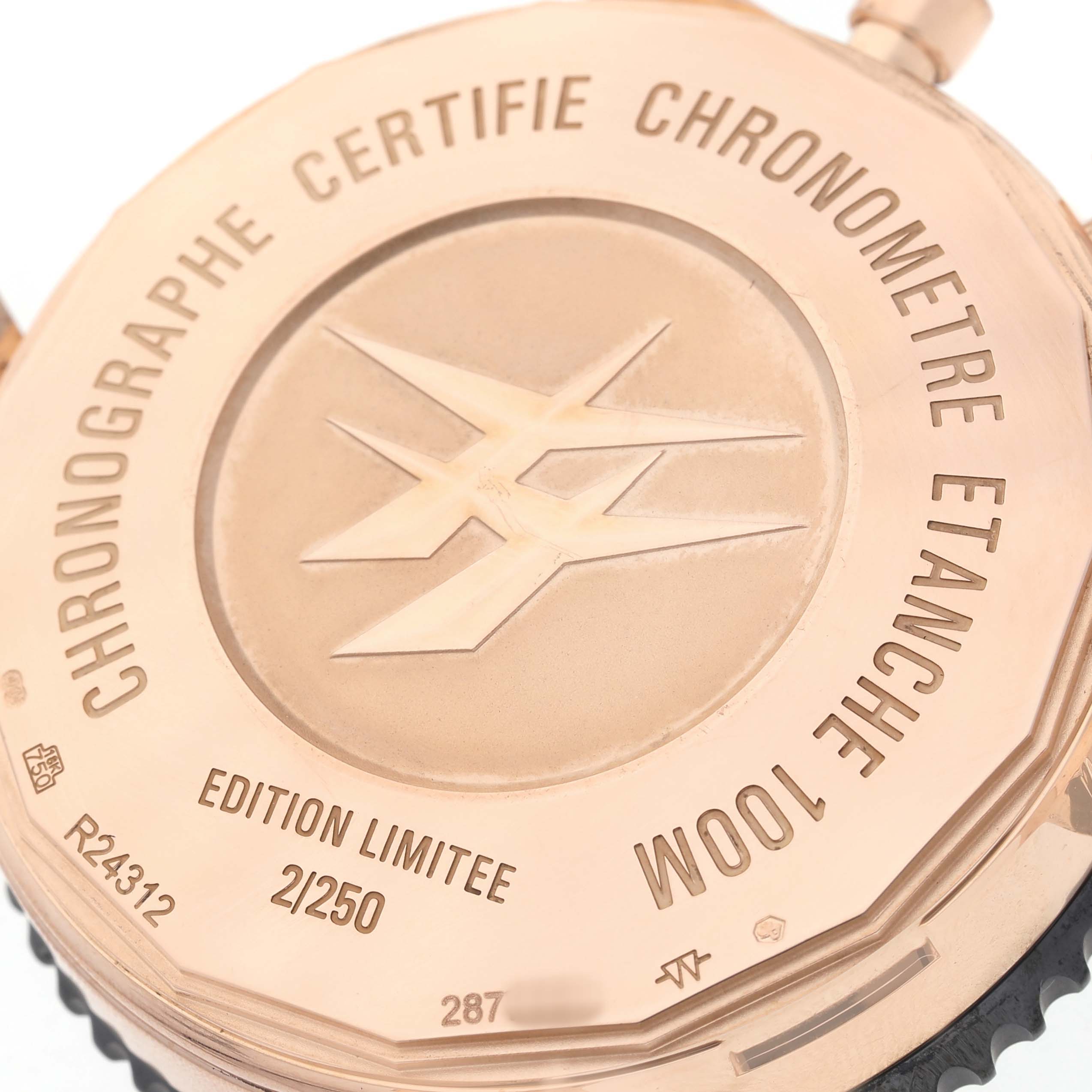 The image shows the back of the Breitling Chronoliner R24312 Men's Rose Gold Black Dial watch, highlighting limited edition details and certification engravings.