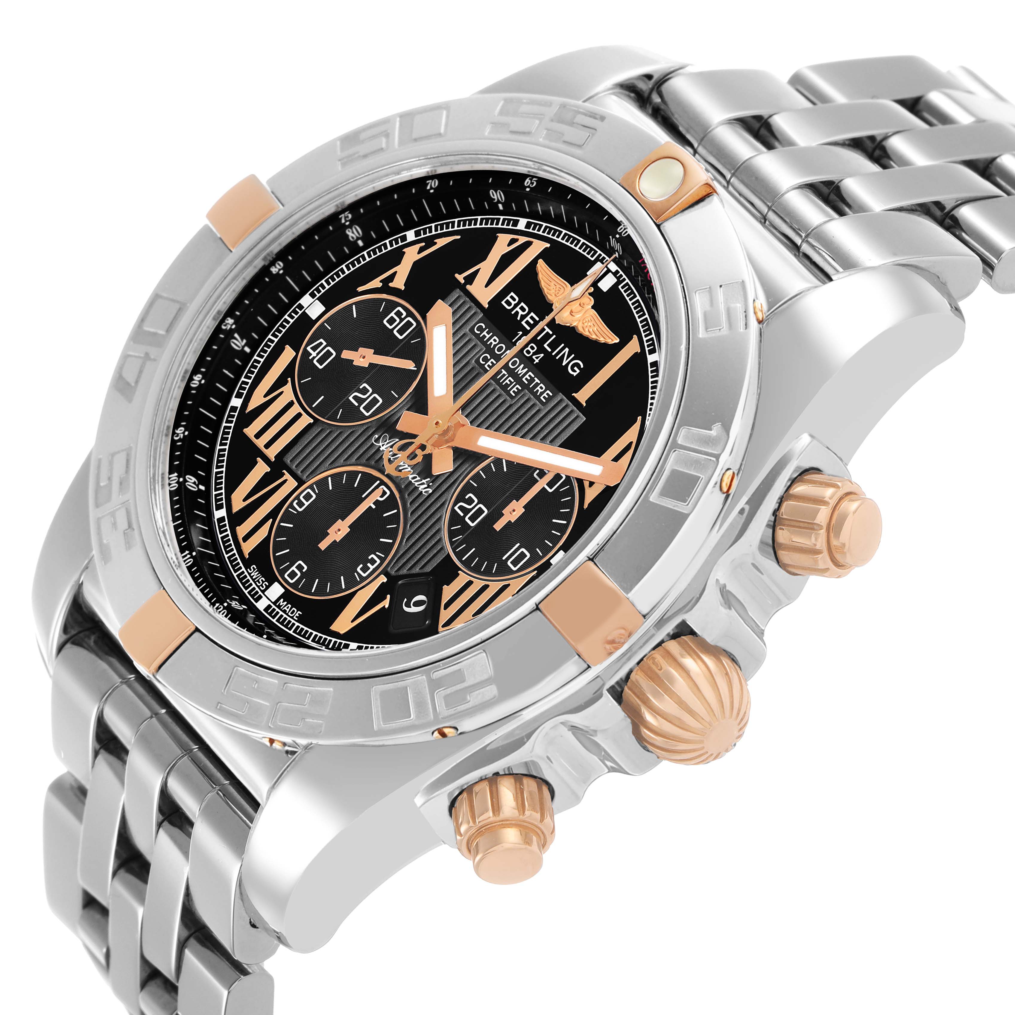 The Breitling Chronomat IB0110 Men's Steel and Gold (two tone) Black Dial watch is shown from an angled side view, displaying the face, bezel, pushers, and part of the bracelet.