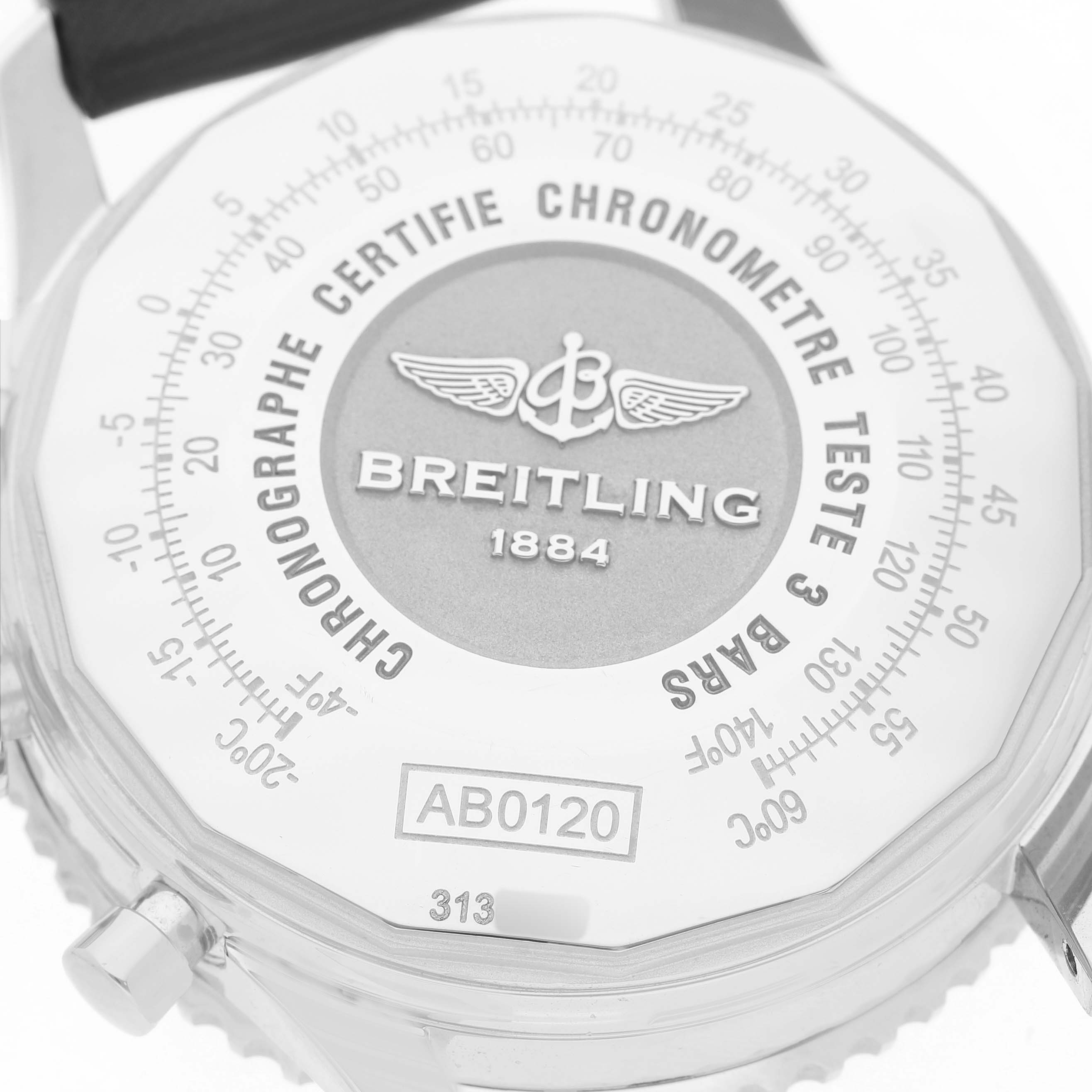 The image shows a close-up of the dial and case of a Breitling Navitimer AB0120 Men's Stainless Steel Black Dial, highlighting branding and numerical details.