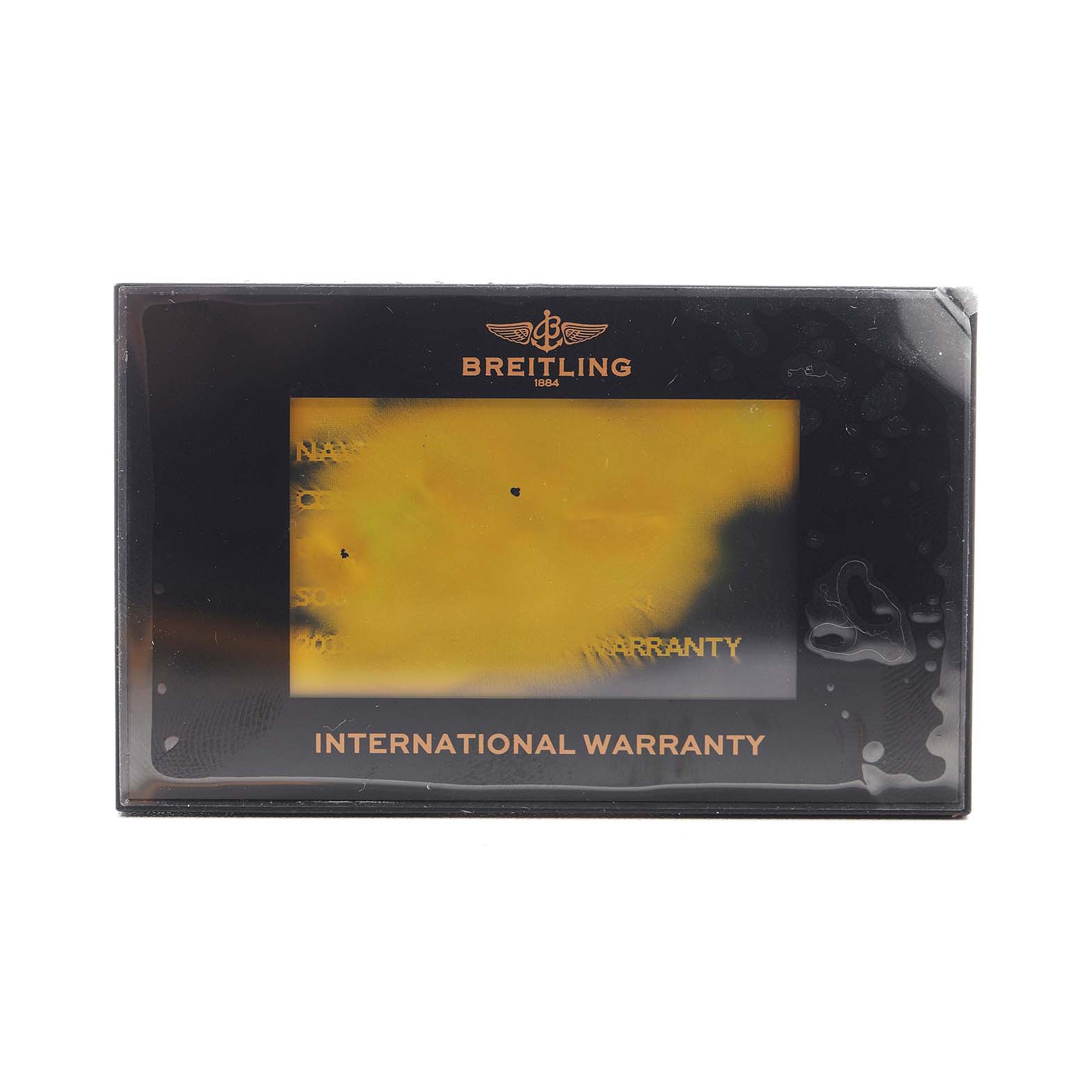 This image shows the International Warranty card for the Breitling Navitimer UB0121 Men's Stainless Steel Grey Dial, displayed from a front angle.