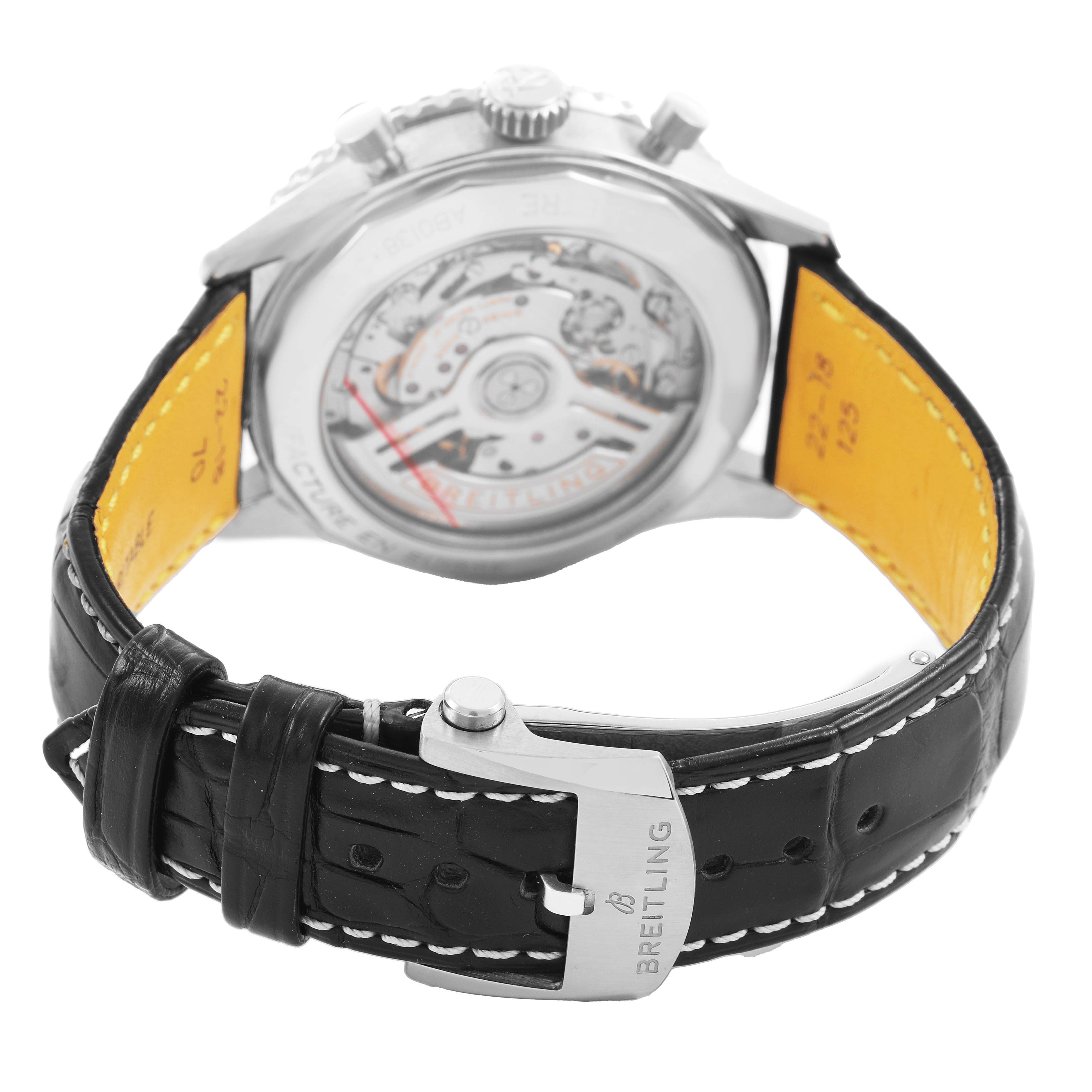 The Breitling Navitimer AB0138 Men's Stainless Steel Blue Dial model is shown from the back, highlighting its movement and black leather strap with a branded buckle.