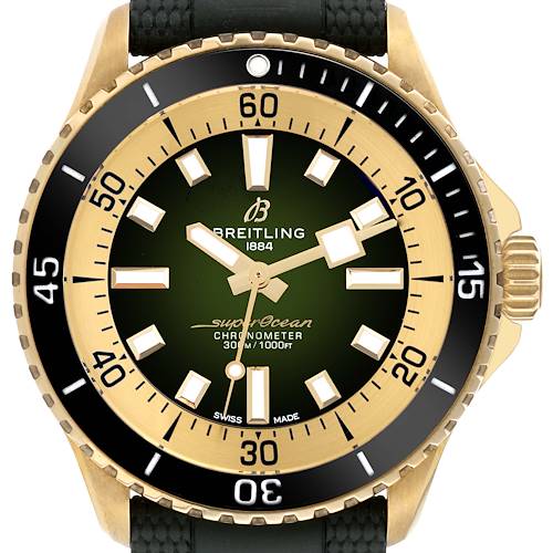 This image shows a Breitling Superocean watch from a front angle, highlighting the green dial, bezel, and part of the black strap.