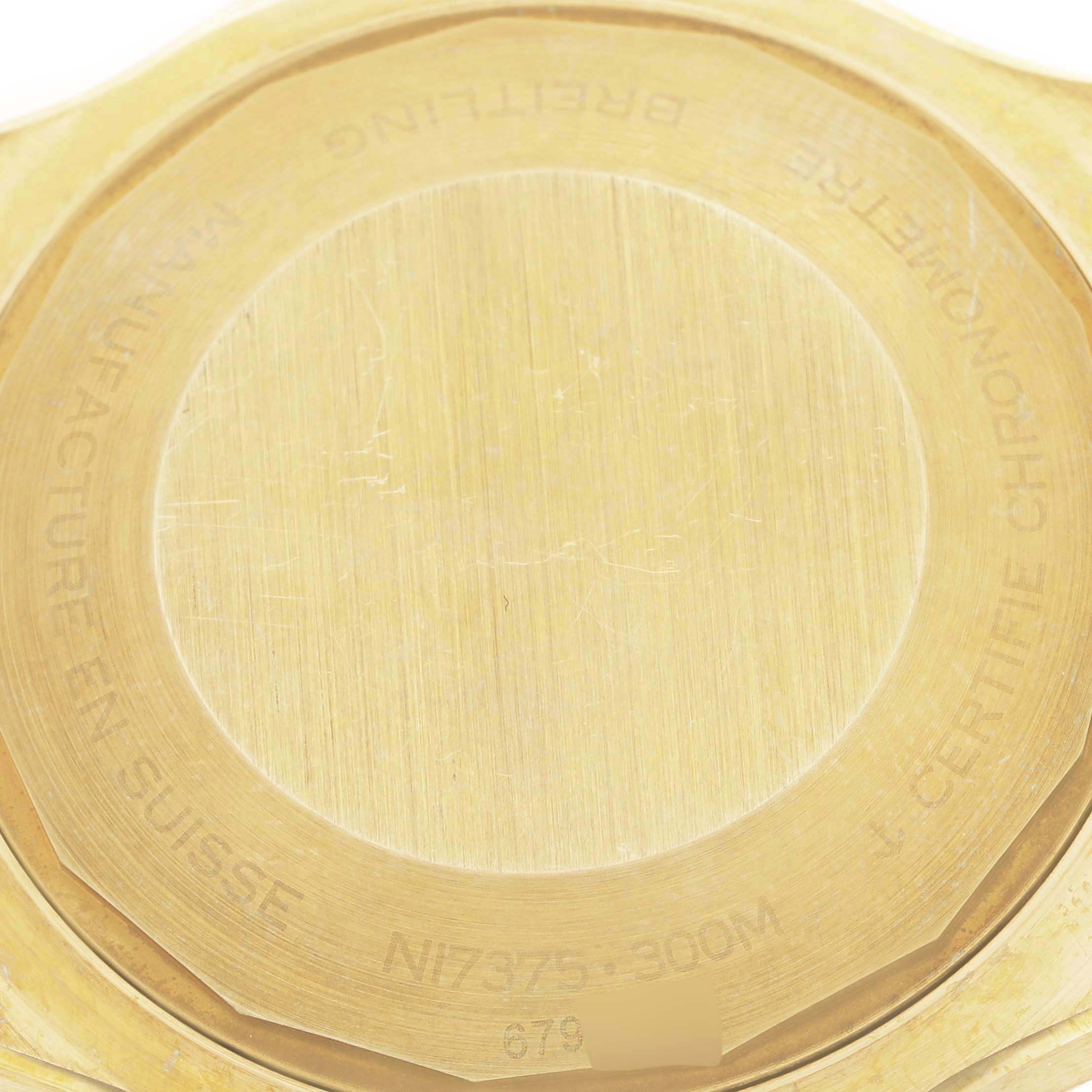 This close-up image shows the back case of a Breitling Superocean N17375 Men
s Yellow Gold Green Dial N17375 Men
s Yellow Gold Green Dial watch.