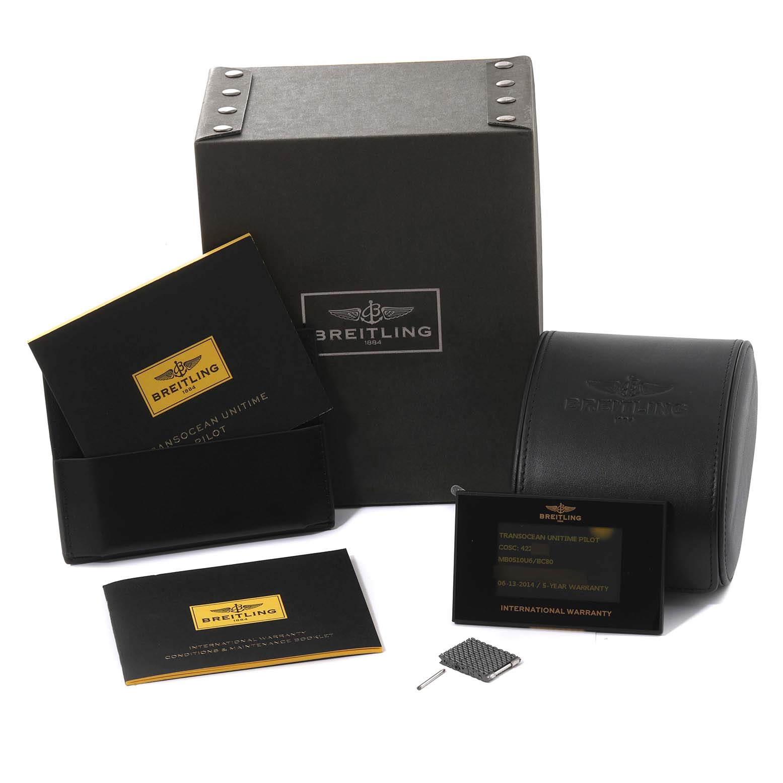The image shows the packaging and accessories for a Breitling Transocean MB0510 Men's Stainless Steel Black Dial MB0510 Men's Stainless Steel Black Dial watch, including boxes, manuals, and warranty cards.