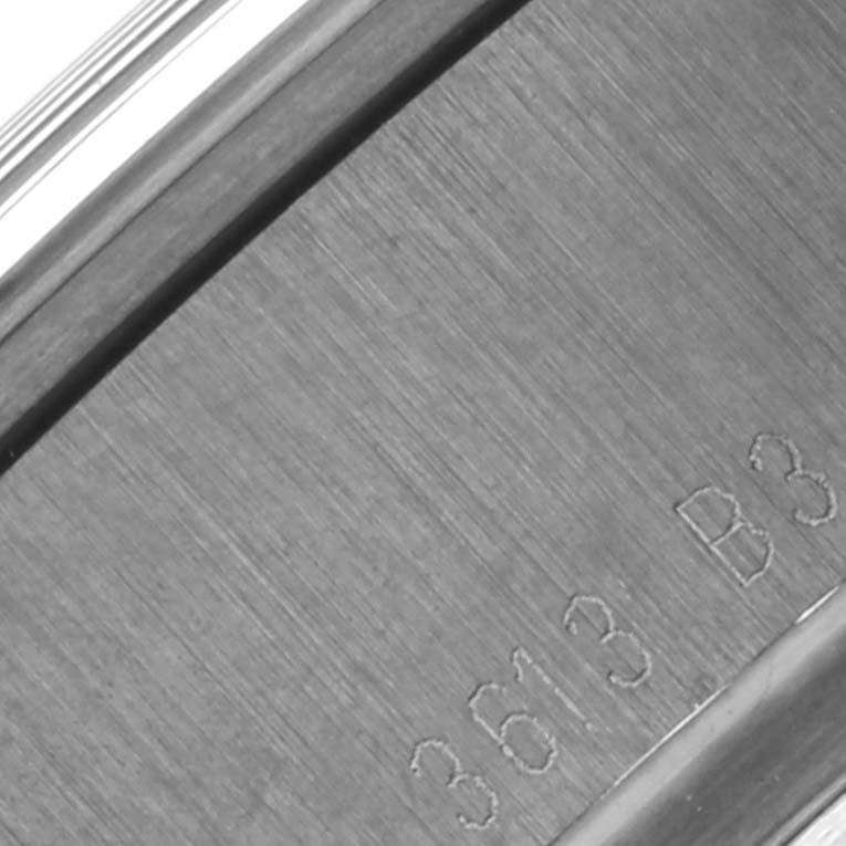 This image shows a close-up angle of the casing side of a Breitling Transocean MB0510 Men's Stainless Steel Black Dial MB0510 Men's Stainless Steel Black Dial watch with some engraved serial numbers.