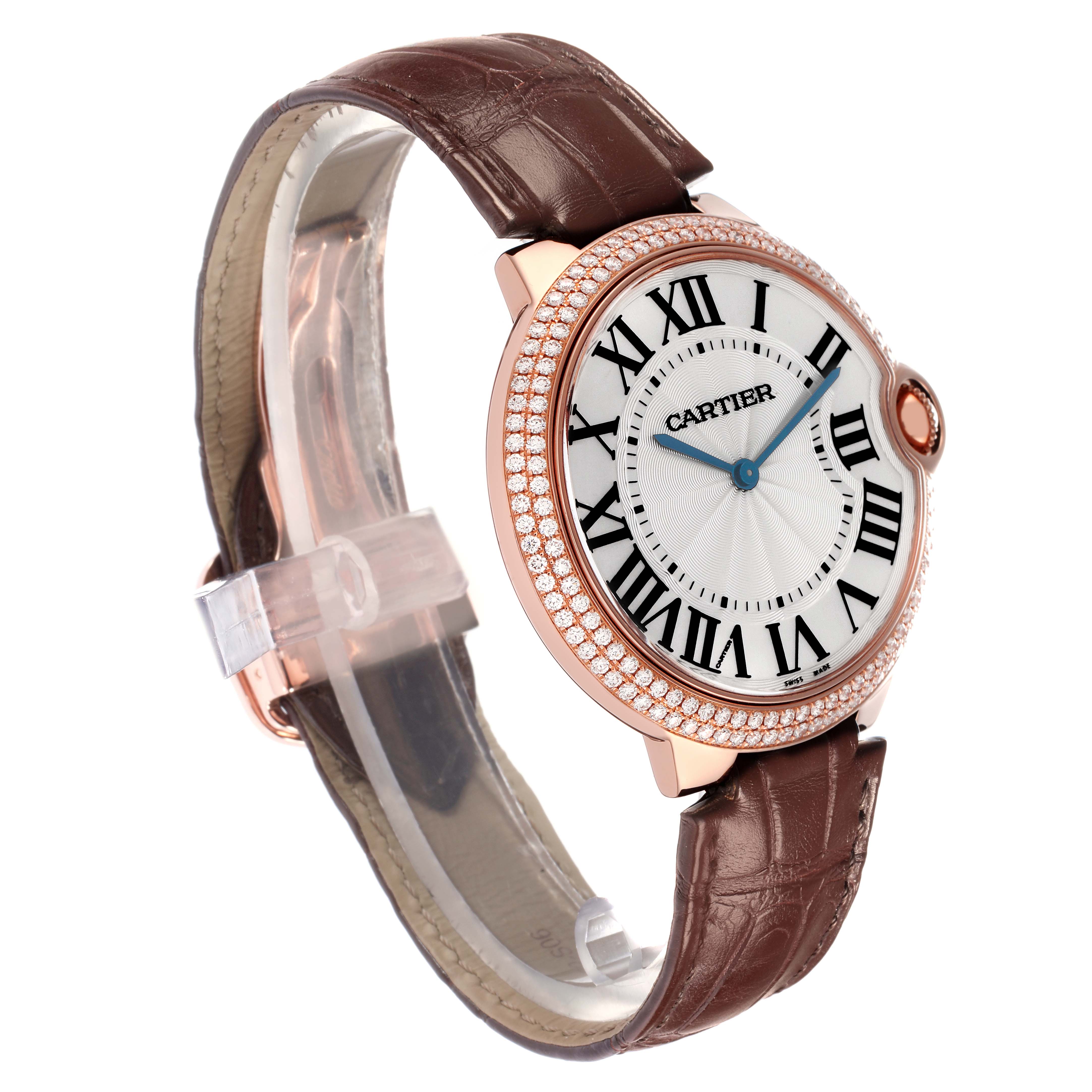 The Cartier Ballon Bleu model WE902055 men
s watch is shown at a side angle, highlighting its round face, Roman numerals, diamond-set bezel, and brown leather strap.
