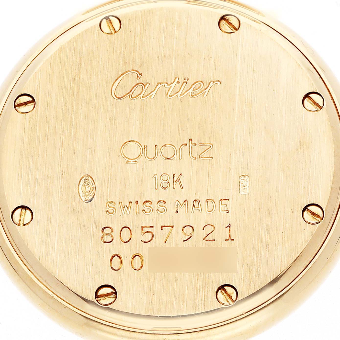 The image shows the back of a Cartier Panthere watch, model number 72634, featuring engravings and screws with a focus on the text "Quartz" and "18K SWISS MADE."