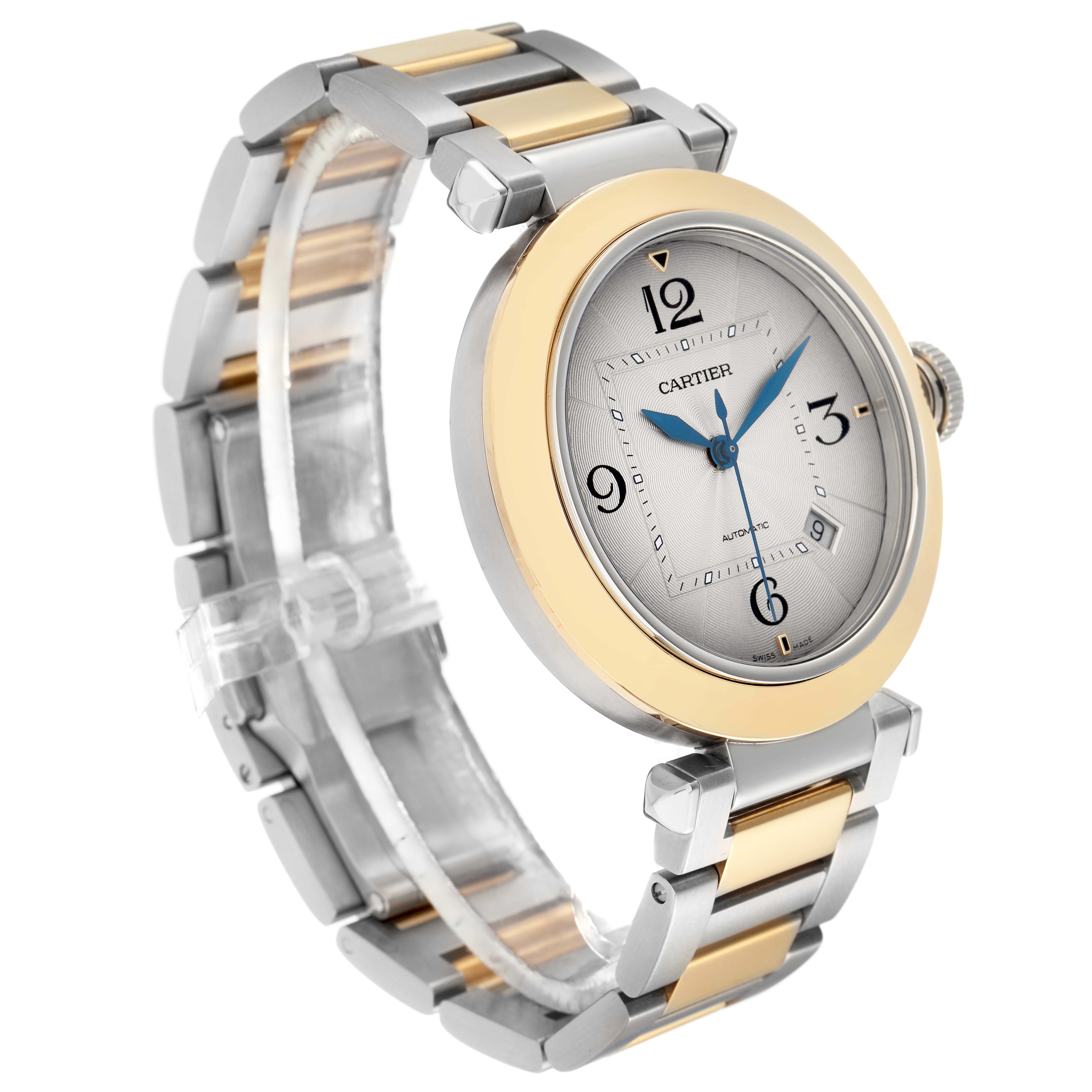 The Cartier Pasha model W2PA0009 watch is shown at a three-quarter angle, highlighting its two-tone bracelet and round face with prominent numerals.