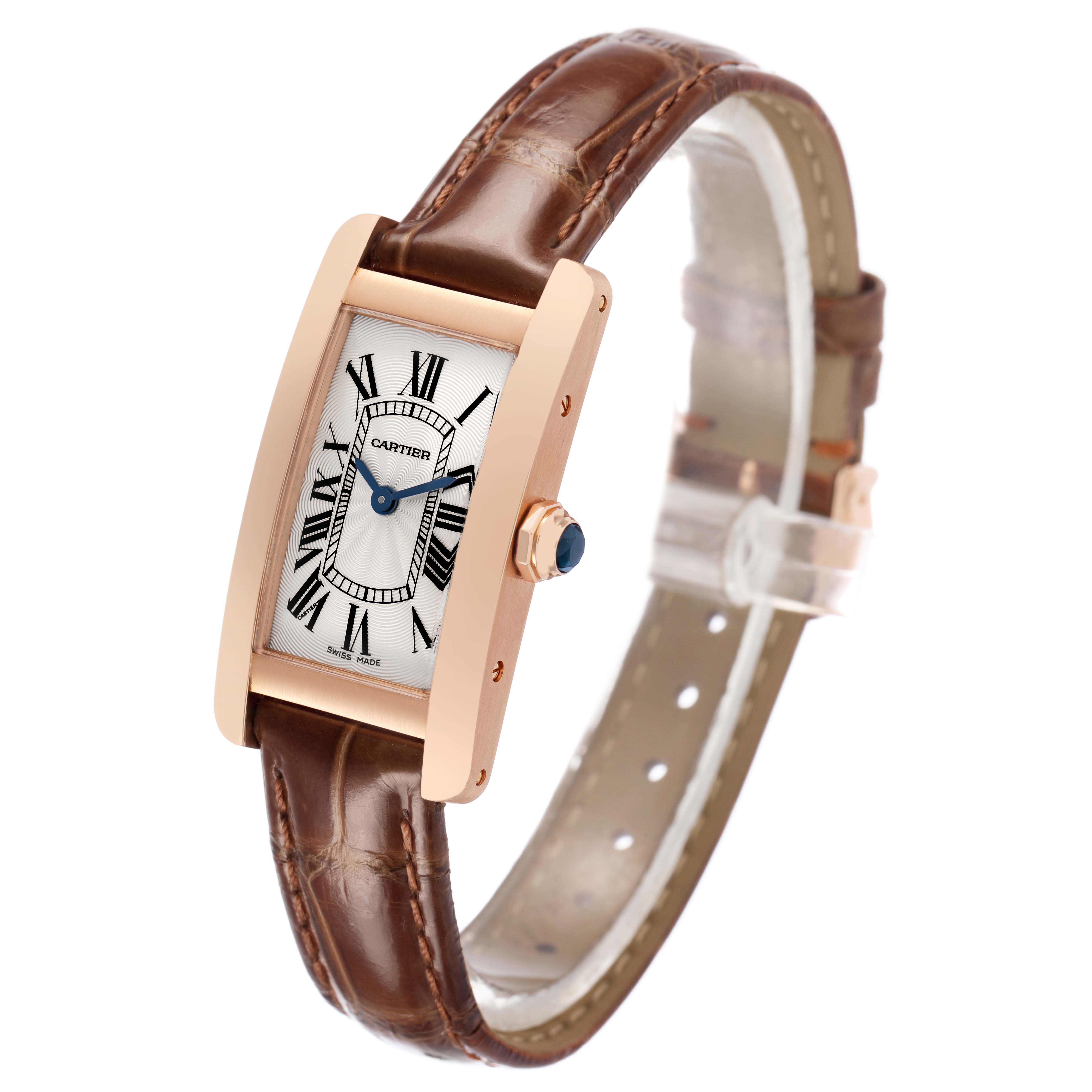 The Cartier Tank Americaine W2607456 Women's Rose Gold Silver Dial watch is shown at a slight angle, highlighting its rectangular case, dial with Roman numerals, and brown leather strap.