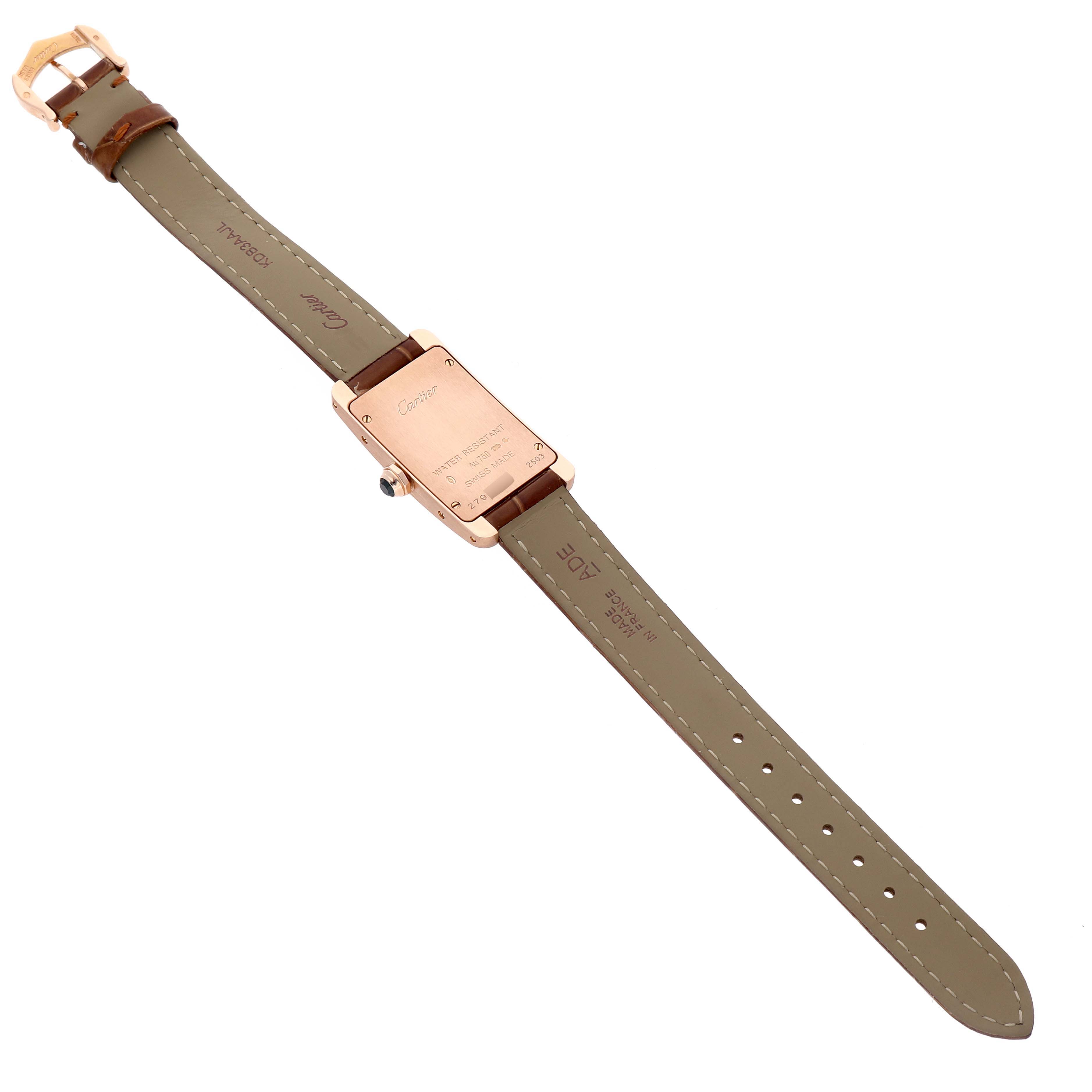 The image shows the back view of a Cartier Tank Americaine W2607456 Women's Rose Gold Silver Dial watch, highlighting the strap and clasp.